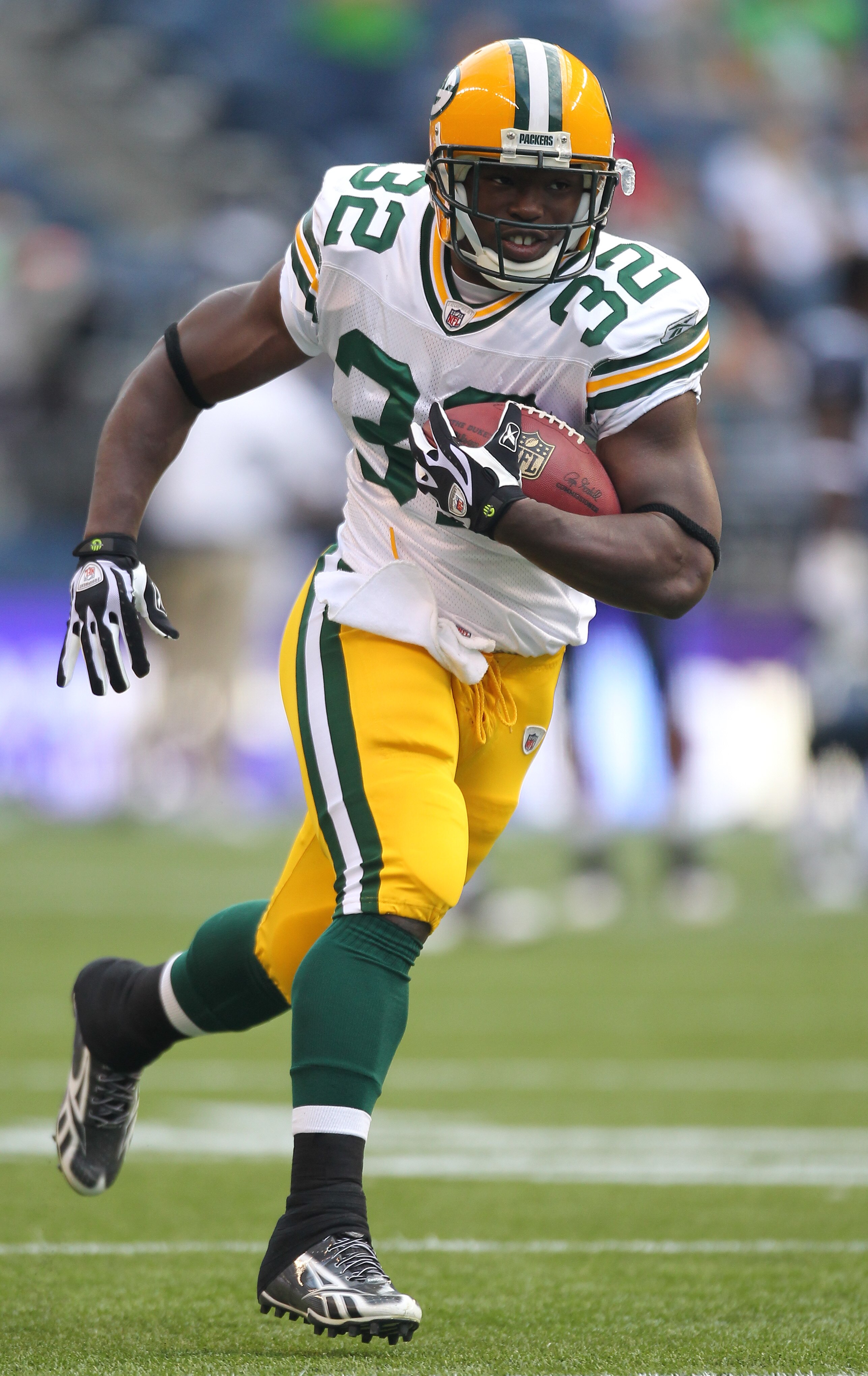 SEATTLE - AUGUST 21:  Running back Brandon Jackson #32 of the Green Bay Packers rushes during warmups prior to the preseason game against the Seattle Seahawks at Qwest Field on August 21, 2010 in Seattle, Washington. (Photo by Otto Greule Jr/Getty Images)