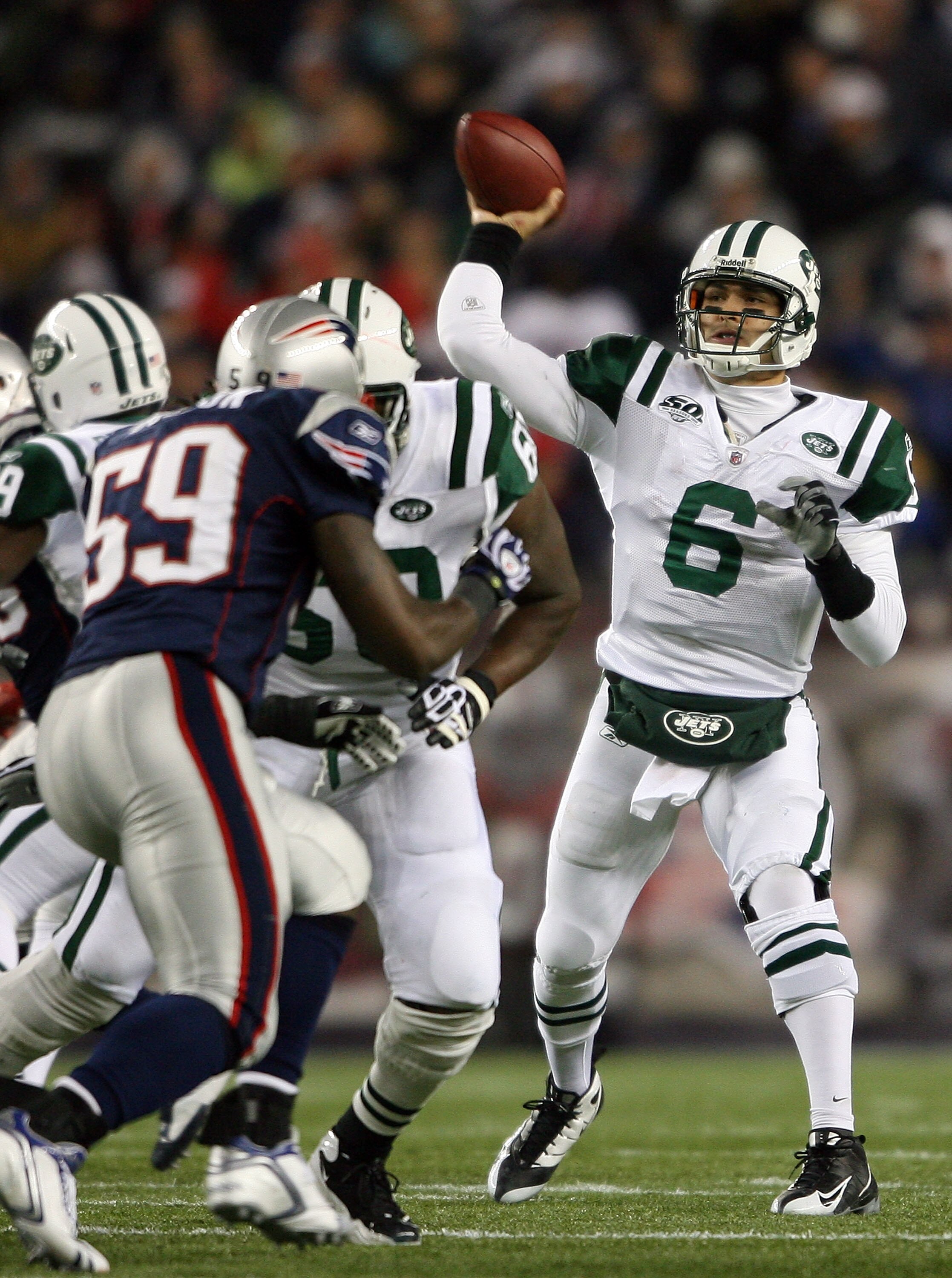 FOXBORO, MA - NOVEMBER 22:  Mark Sanchez #6 of the New York Jets throws an interception in the fourth quarter as Gary Guyton #59 of the New England Patriots on November 22, 2009 at Gillette Stadium in Foxboro, Massachusetts. The Patriots defeated the Jets