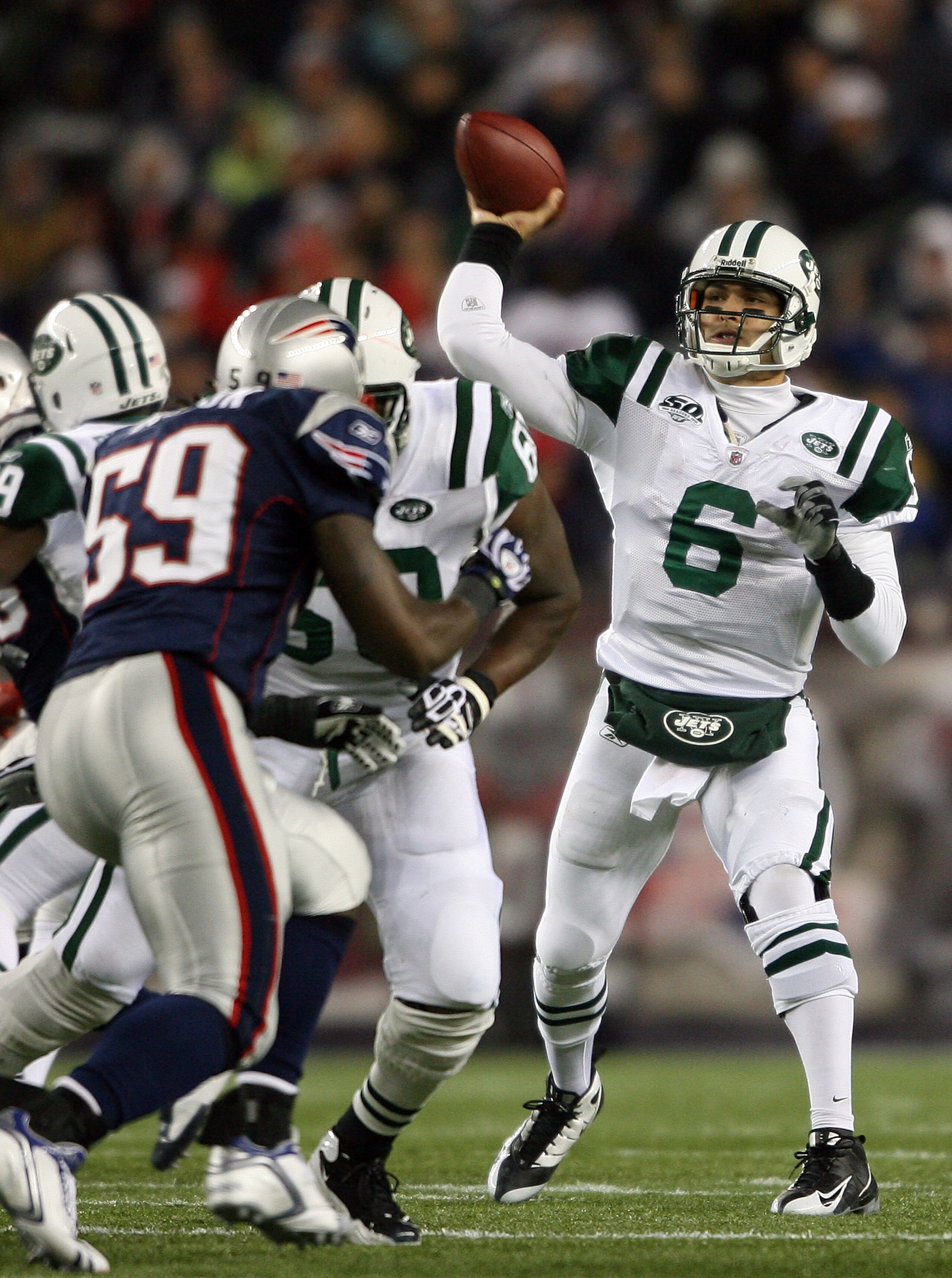 FOXBORO, MA - NOVEMBER 22:  Mark Sanchez #6 of the New York Jets throws an interception in the fourth quarter as Gary Guyton #59 of the New England Patriots on November 22, 2009 at Gillette Stadium in Foxboro, Massachusetts. The Patriots defeated the Jets