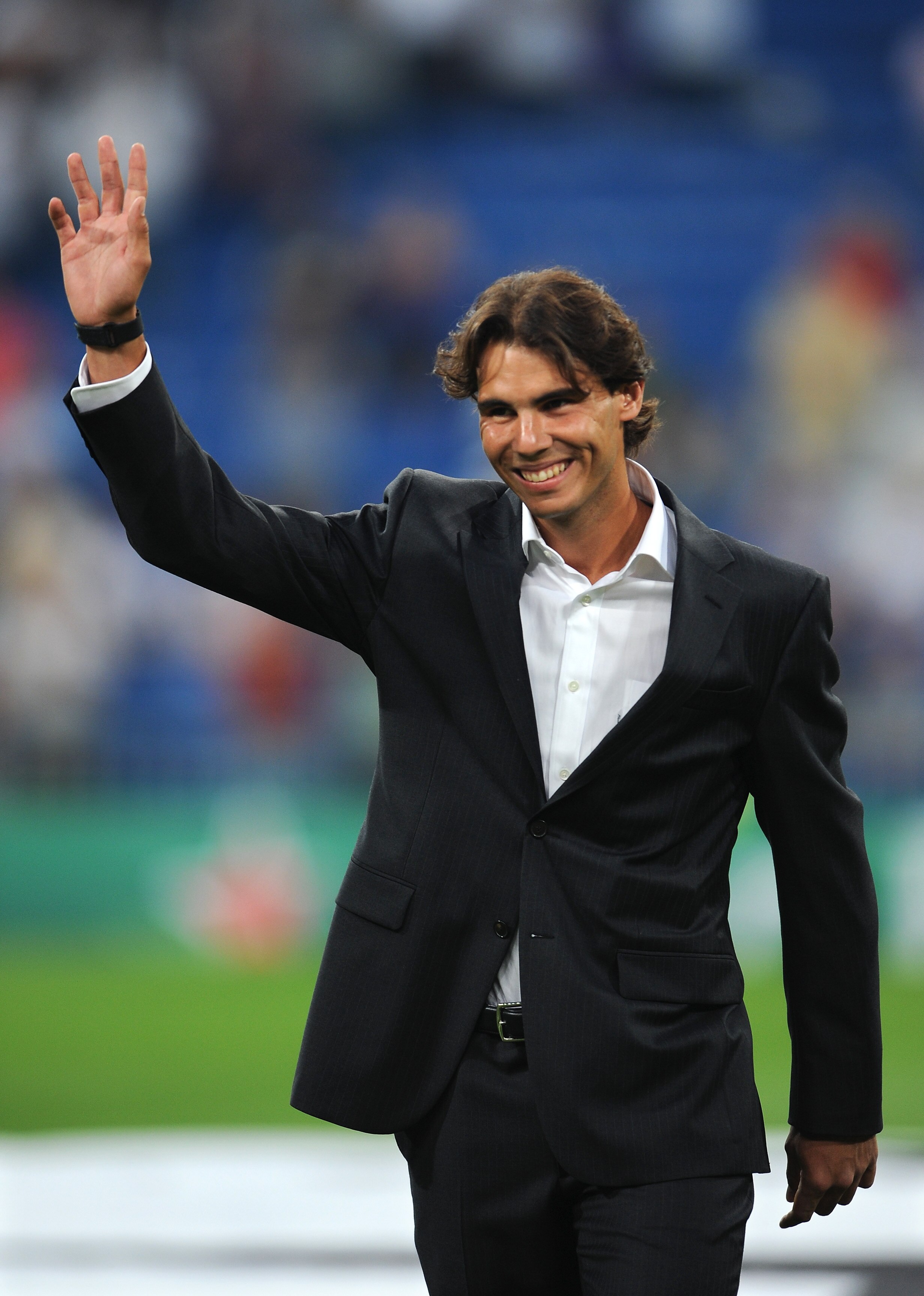 MADRID, SPAIN - SEPTEMBER 15: Rafael Nadal of Spain, the 2010 U.S. Open Champion, acknowledges the crowd prior to the start of the UEFA Champions League group G match between Real Madrid and Ajax at the Estadio Santiago Bernabeu on September 15, 2010 in M