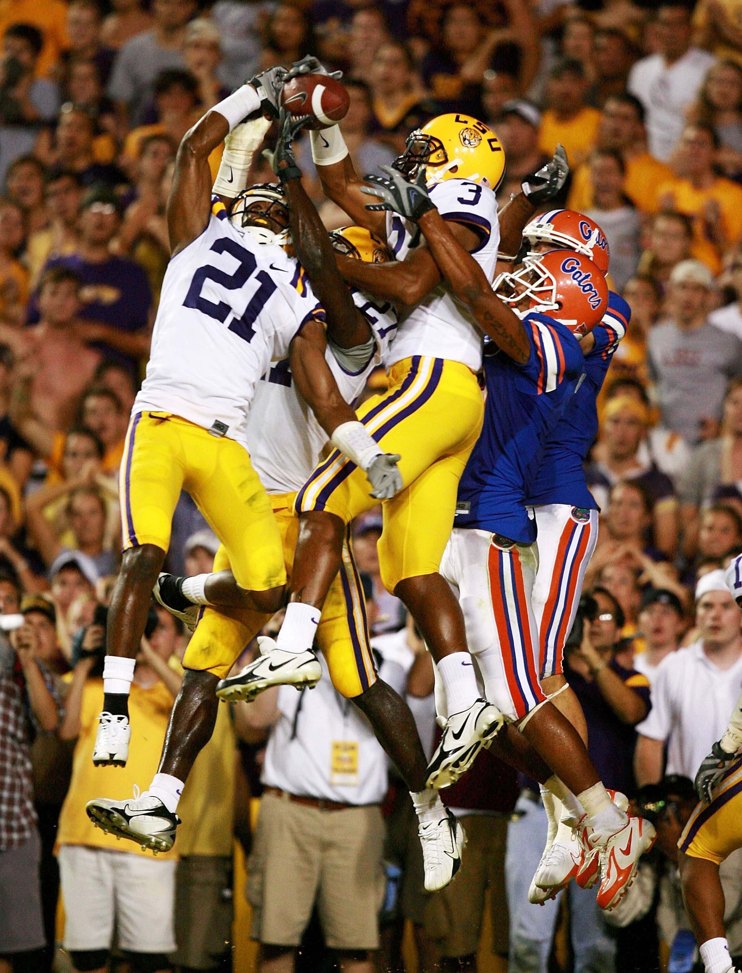BATON ROUGE, LA - OCTOBER 06:  Defensive backs Chevis Jackson #21 and Chad Jones #3 of the LSU Tigers knock down a last second hail-mary attempt by quarterback Tim Tebow #15 of the Florida Gators at Tiger Stadium on October , 2007 in Baton Rouge, Louisian