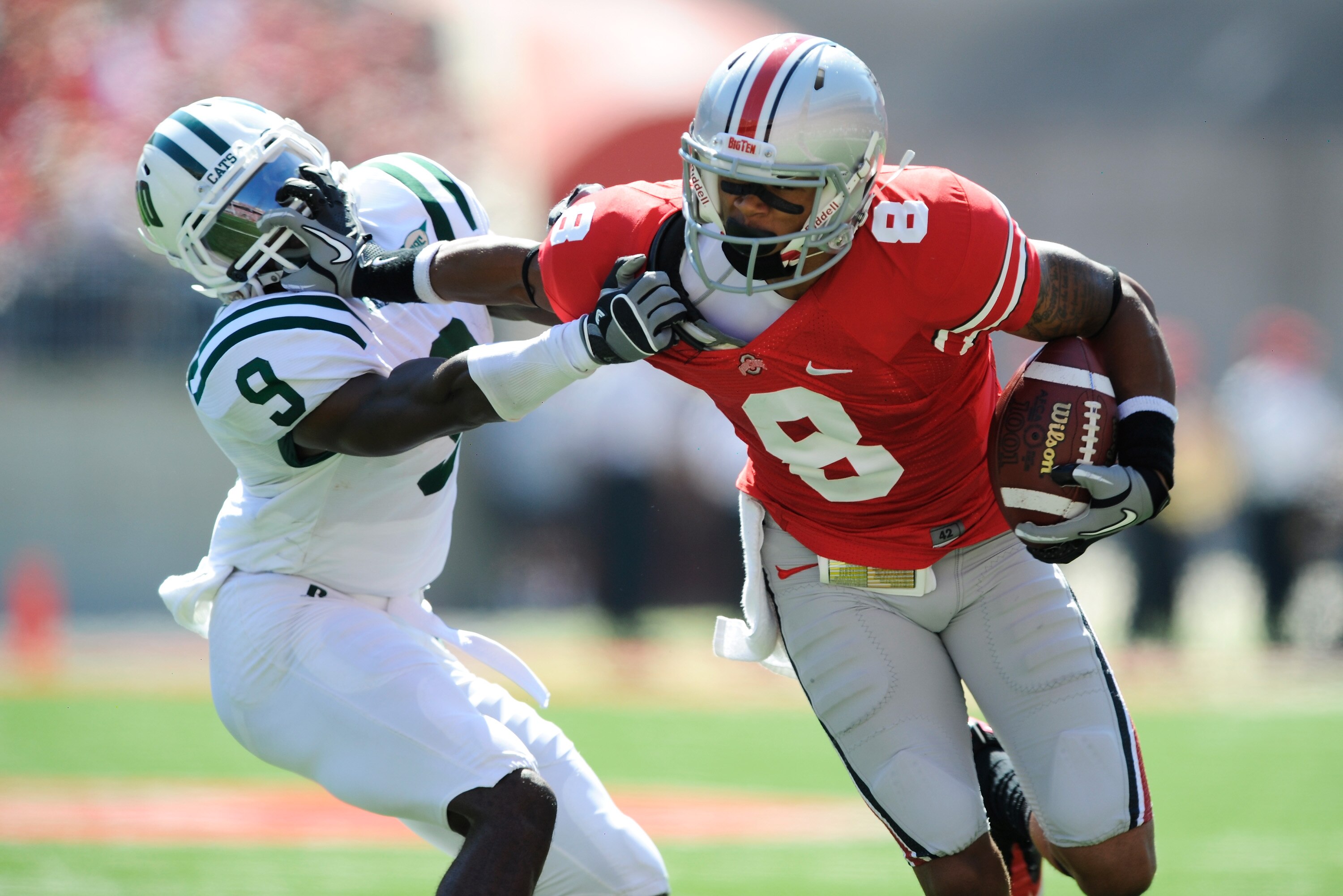 COLUMBUS, OH - SEPTEMBER 18:  DeVier Posey #8 of the Ohio State Buckeyes stiff arms his brother Julian Posey #9 of the Ohio Bobcats at Ohio Stadium on September 18, 2010 in Columbus, Ohio.  (Photo by Jamie Sabau/Getty Images)