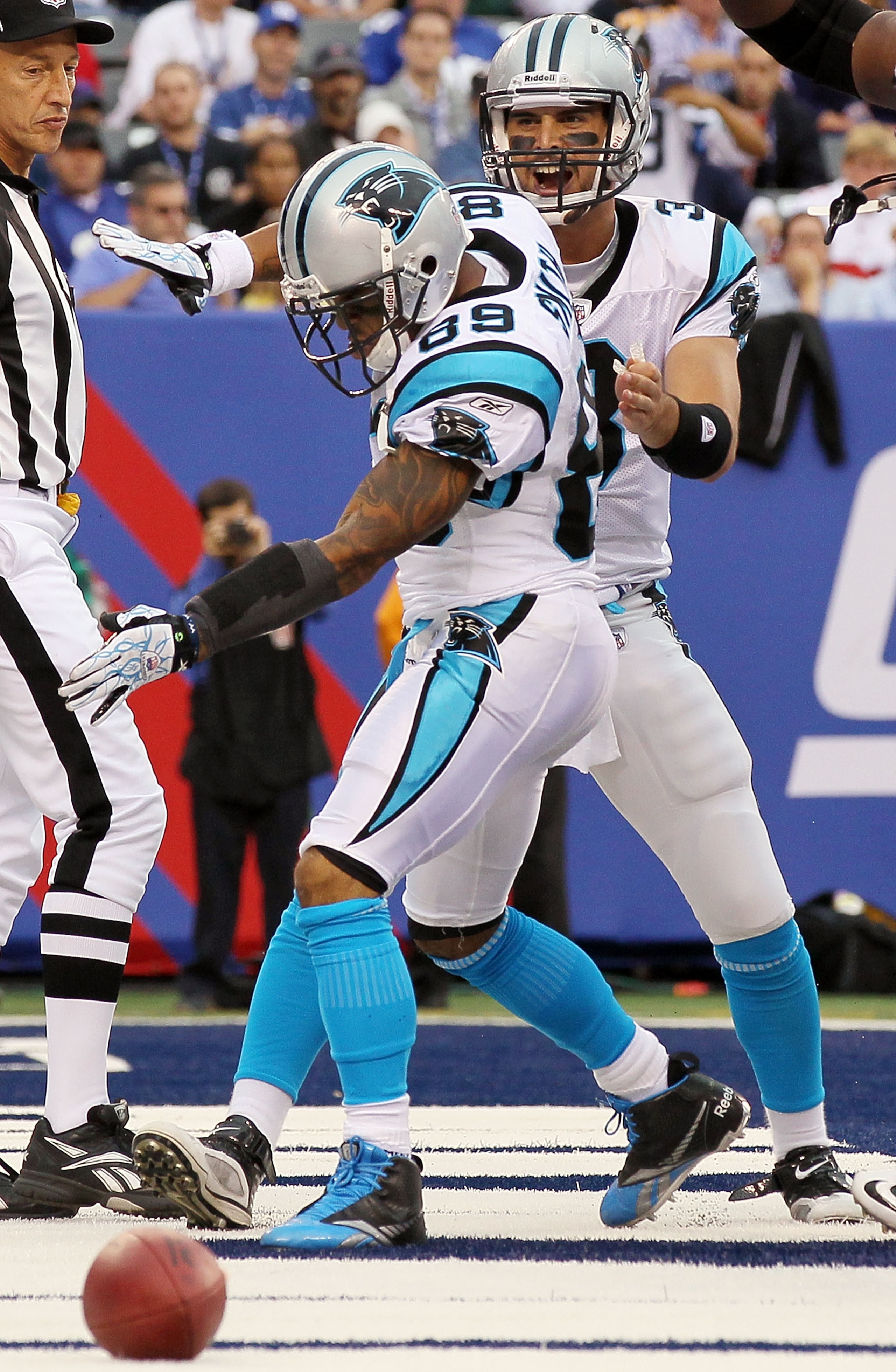EAST RUTHERFORD, NJ - SEPTEMBER 12:  Steve Smith #89 of the Carolina Panthers celebrates his touchdown against the New York Giants with teammate Matt Moore #3 on September 12, 2010 at the New Meadowlands Stadium in East Rutherford, New Jersey.  (Photo by 