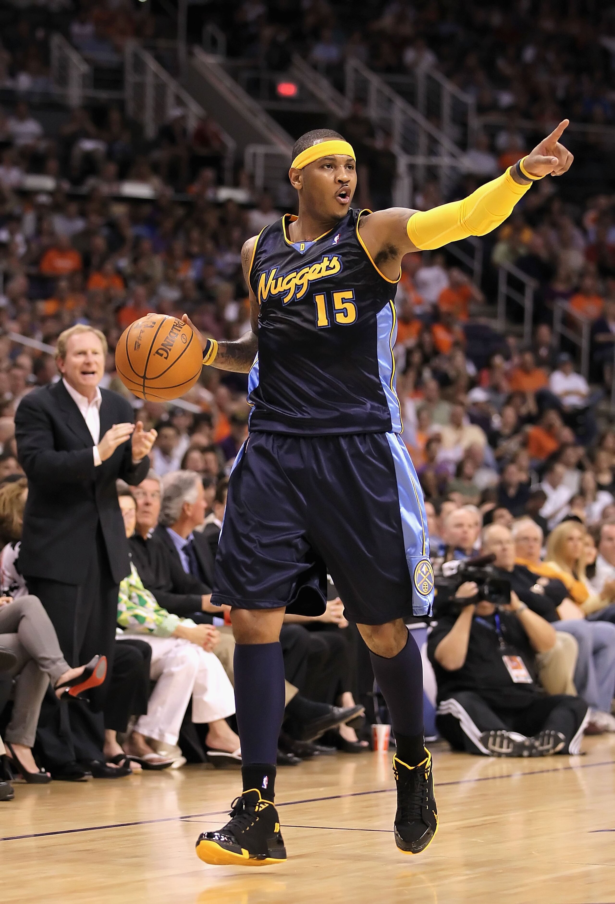 PHOENIX - APRIL 13:  Carmelo Anthony #15 of the Denver Nuggets handles the ball during the NBA game against the Phoenix Suns at US Airways Center on April 13, 2010 in Phoenix, Arizona. The Suns defeated the Nuggets 123-101.  NOTE TO USER: User expressly a