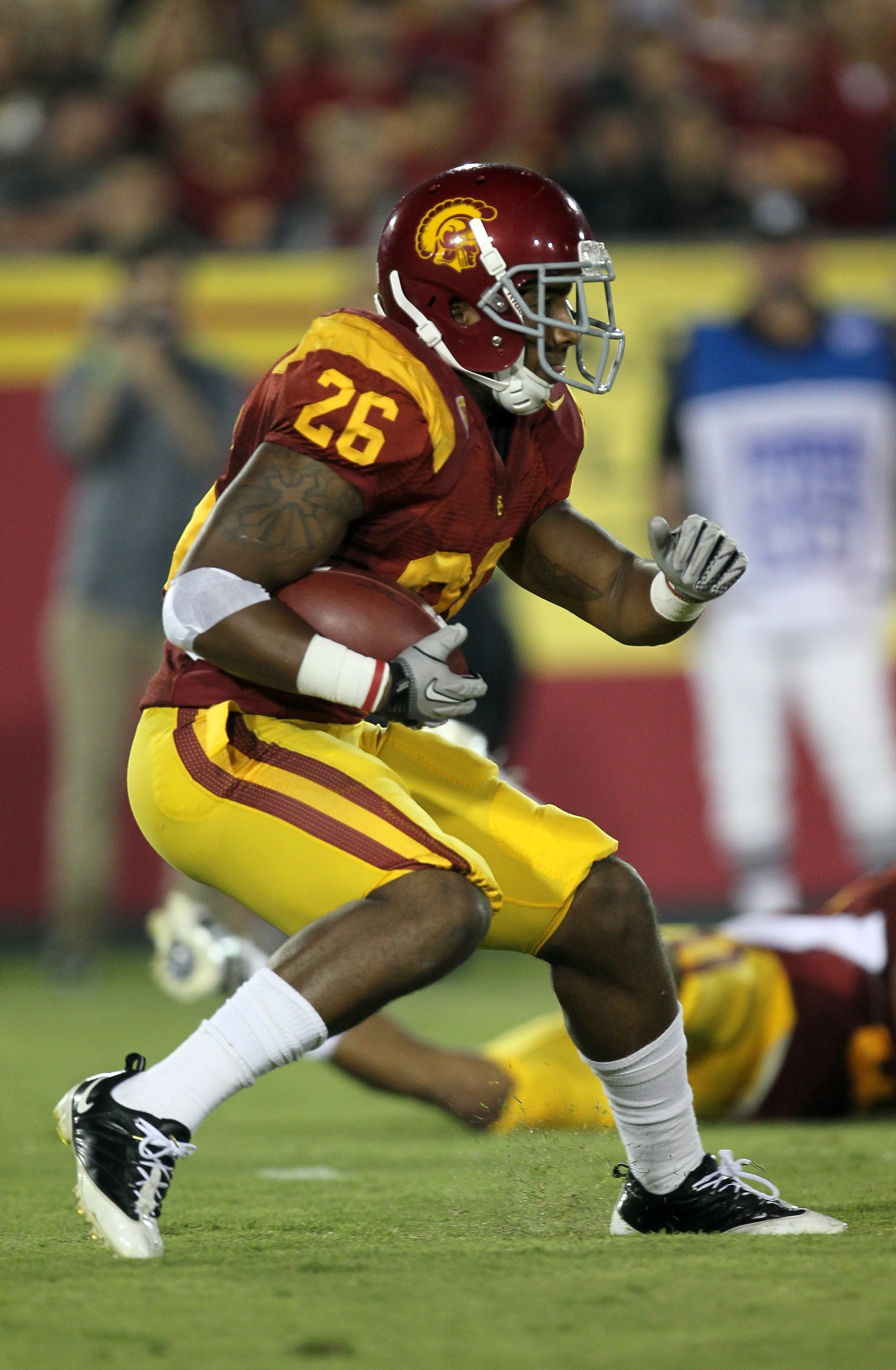 LOS ANGELES, CA - SEPTEMBER 11:  Running back Marc Tyler #26 of the USC Trojans carries the ball against the Virginia Cavaliers at Los Angeles Memorial Coliseum on September 11, 2010 in Los Angeles, California. USC won 17-14.  (Photo by Stephen Dunn/Getty