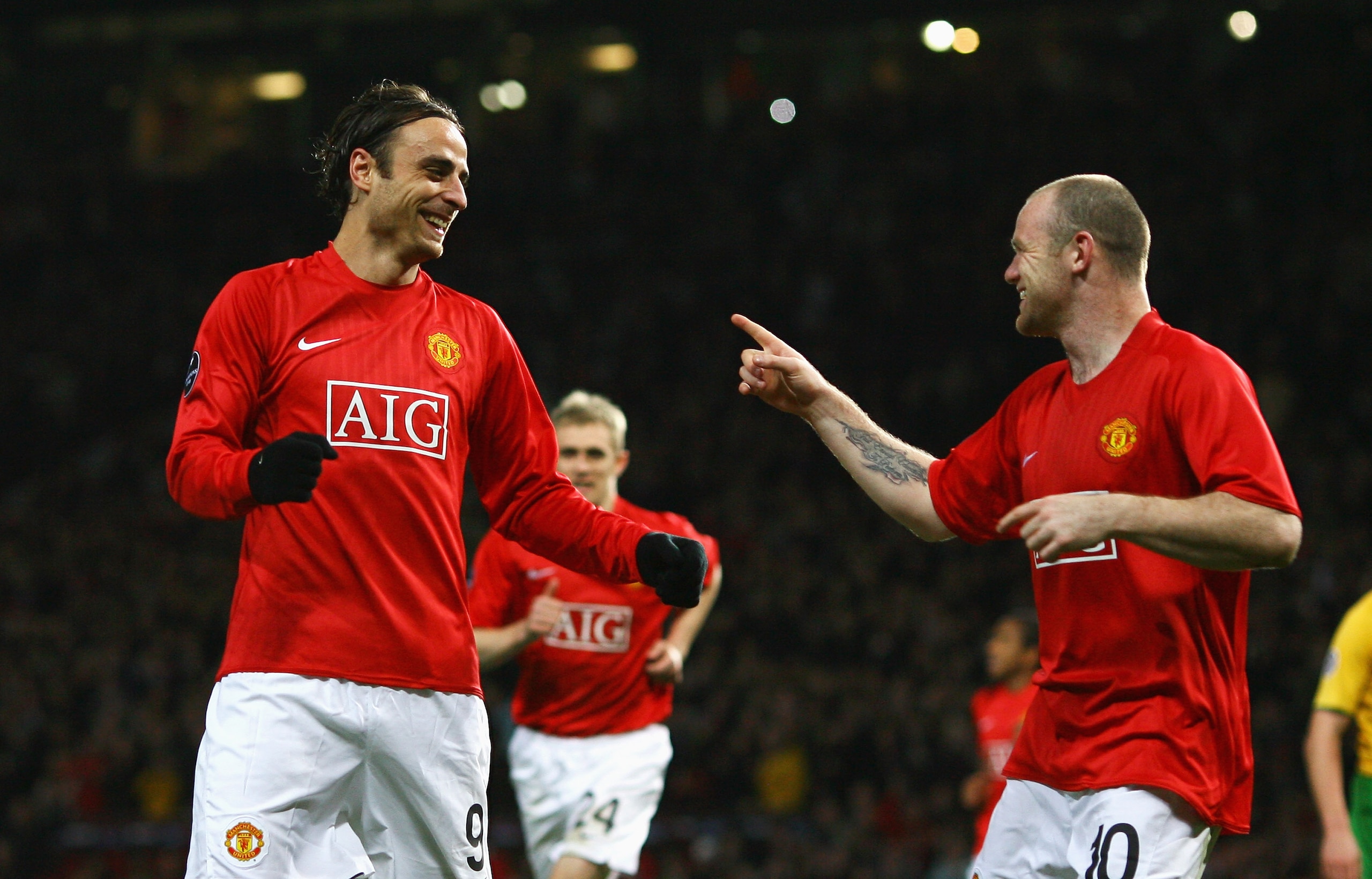 MANCHESTER, UNITED KINGDOM - OCTOBER 21:  Dimitar Berbatov (L) of Manchester United celebrates his second goal with team mate Wayne Rooney during the UEFA Champions League Group E match between Manchester United and Celtic at Old Trafford on October 21, 2