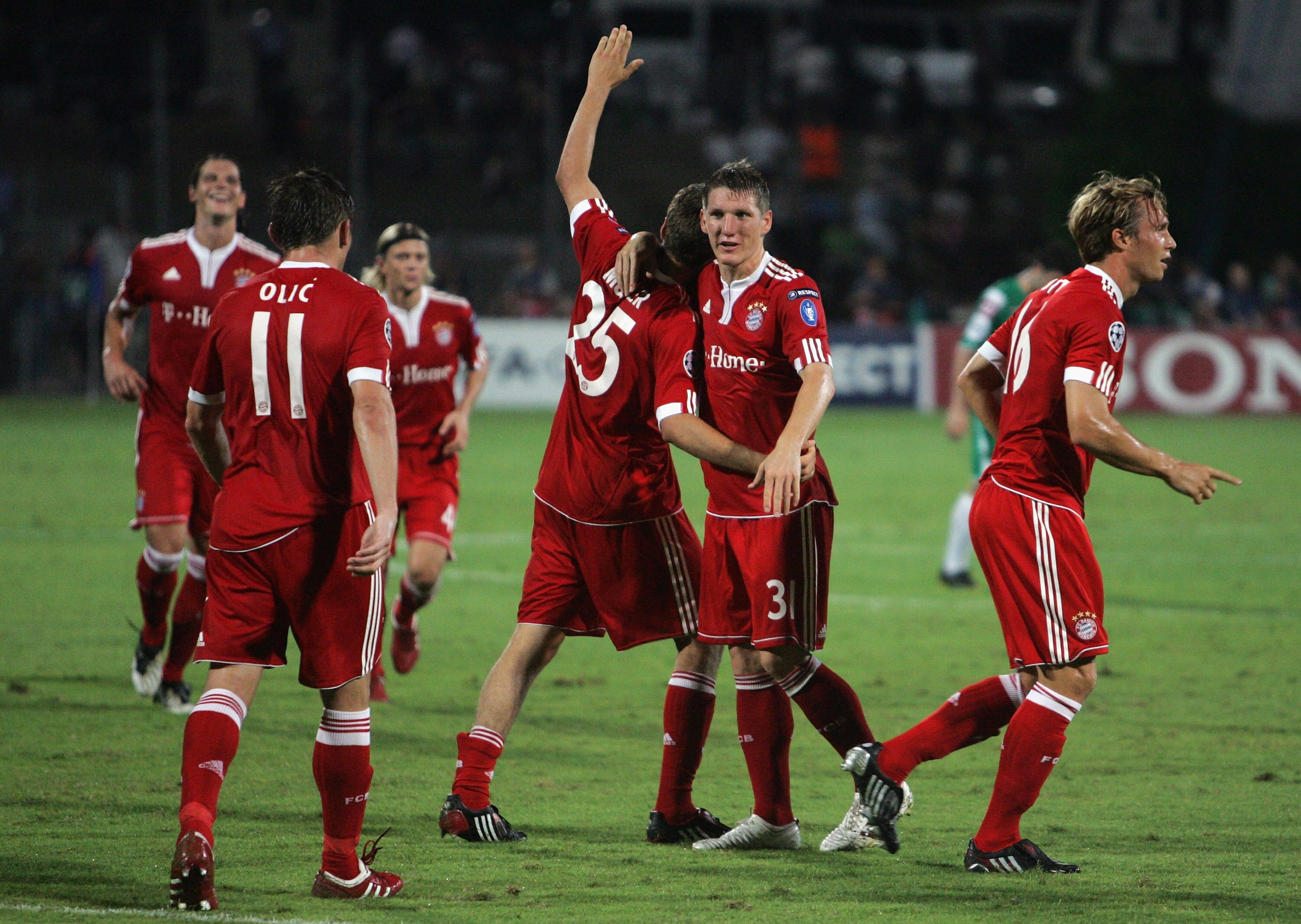RAMAT GAN, ISRAEL - SEPTEMBER 15:  Bayern Muenchen's Thomas Muller (25) celebrates his 85th minute goal with teammate Bastian Schweinsteiger during the UEFA Champions League Group A match between Maccabi Haifa and FC Bayern Muenchen at Ramat Gan Stadium o