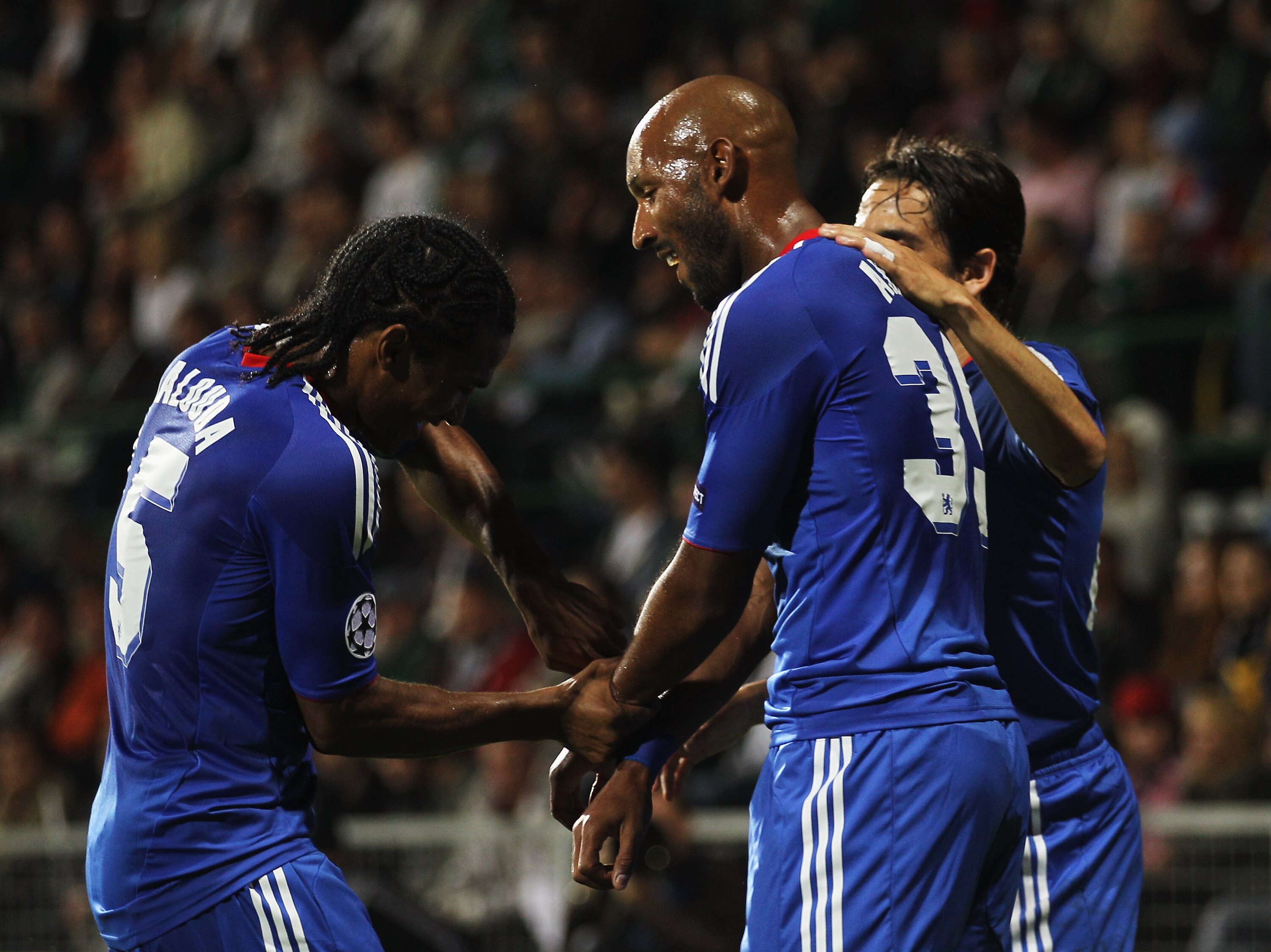 ZILINA, SLOVAKIA - SEPTEMBER 15:  Nicolas Anelka of Chelsea (C) celebrates with Florent Malouda (L) and Yossi Benayoun scores their second goal during the UEFA Champions League Group F match between MSK Zilina and Chelsea at the Pod Dubnom Stadium on Sept