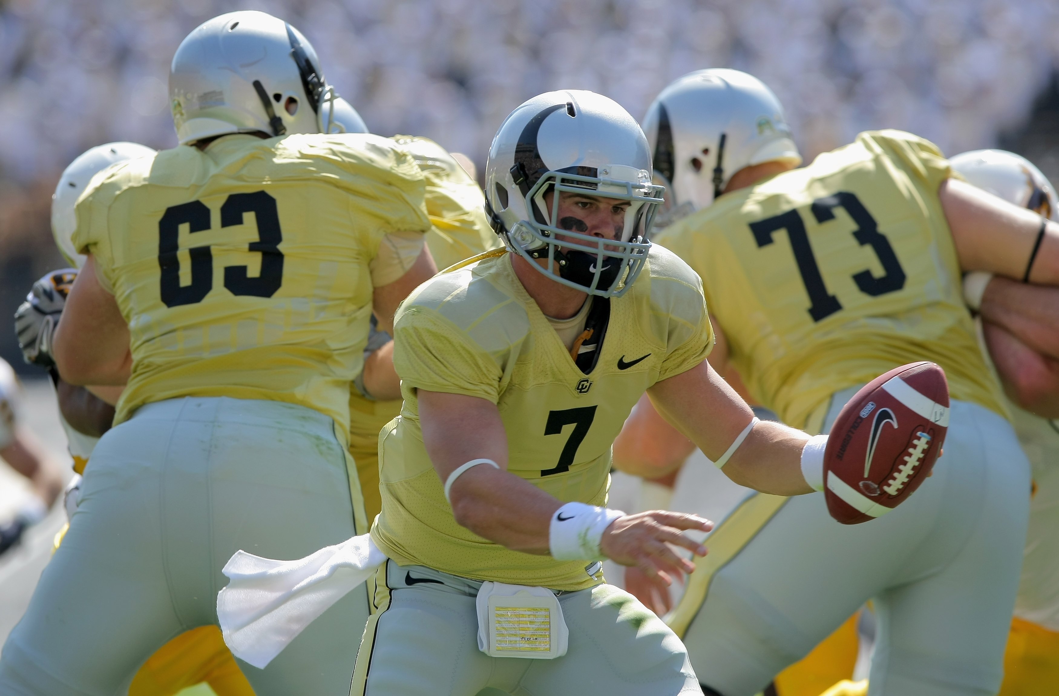 BOULDER, CO - SEPTEMBER 19:  Quarterback Cody Hawkins #7 of the Colorado Buffaloes hands off the ball against the Wyoming Cowboys at Folsom Field on September 19, 2009 in Boulder, Colorado. The Buffaloes defeated the Cowboys 24-0.  (Photo by Doug Pensinge