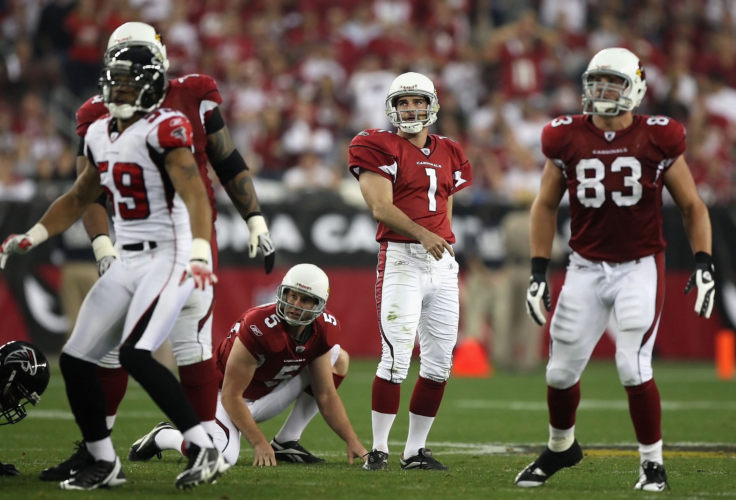 GLENDALE, AZ - JANUARY 03:  Kicker Neil Rackers #1 of the Arizona Cardinals watches his field goal miss during the NFC Wild Card Game against the Atlanta Falcons on January 3, 2009 at University of Phoenix Stadium in Glendale, Arizona. The Cardinals defea