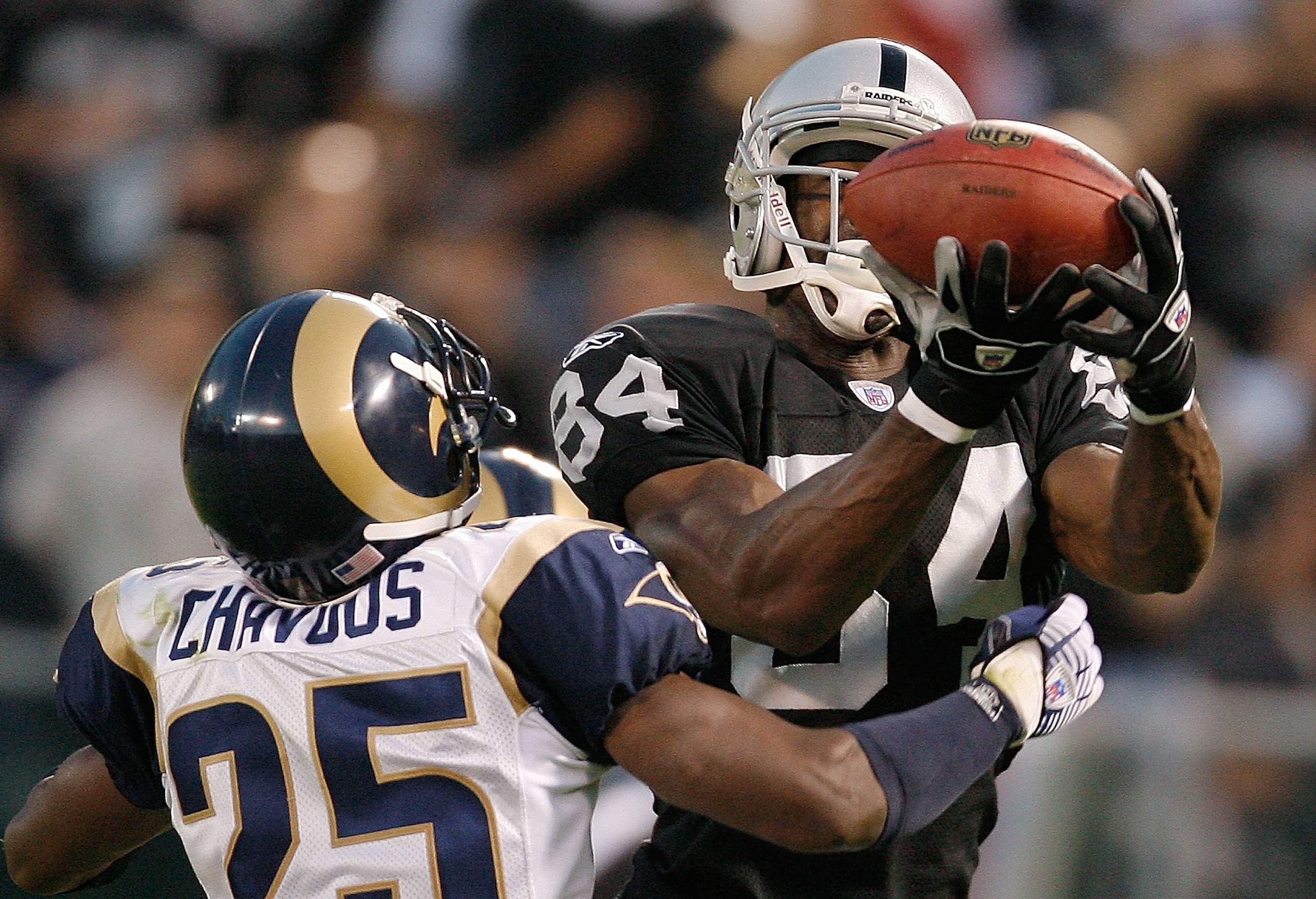 OAKLAND, CA - AUGUST 24:  Wide receiver Jerry Porter #84 of the Oakland Raiders drops a pass as defensive back Corey Chavous #25 of the St. Louis Rams defends during a preseason game on August 24, 2007 at McAfee Coliseum.  (Photo by Greg Trott/Getty Image