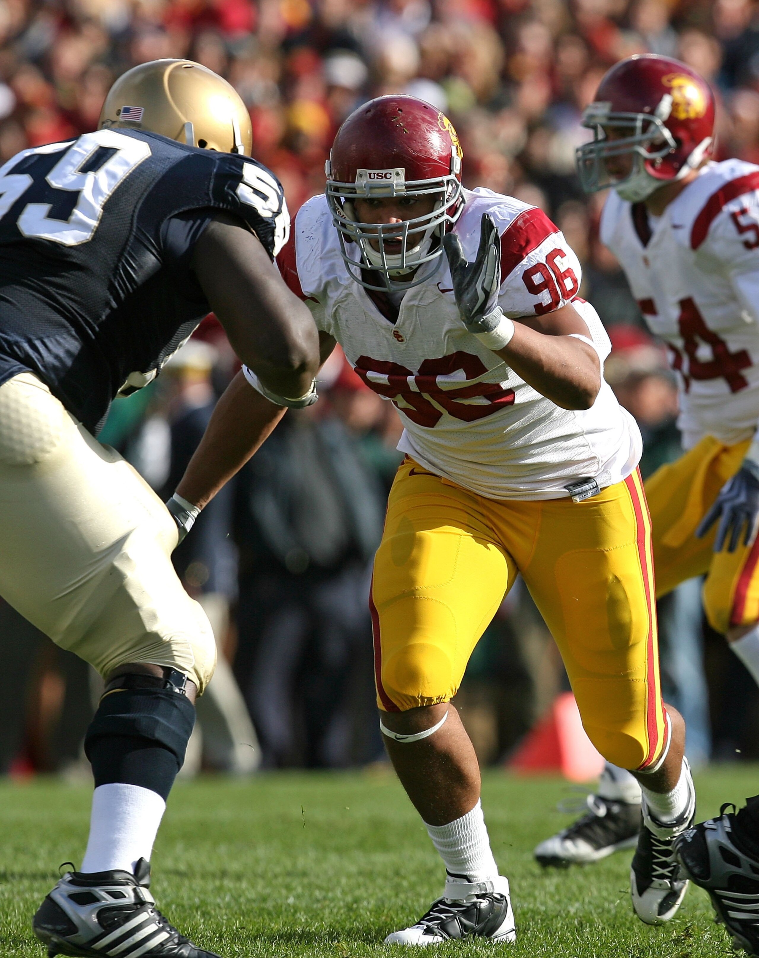 SOUTH BEND, IN - OCTOBER 17: Wes Horton #96 of the USC Trojans rushes against Chris Stewart #59 of the Notre Dame Fighting Irish at Notre Dame Stadium on October 17, 2009 in South Bend, Indiana. USC defeated Notre Dame 34-27. (Photo by Jonathan Daniel/Get SOUTH BEND, IN - OCTOBER 17: Wes Horton #96 of the USC Trojans rushes against Chris Stewart #59 of the Notre Dame Fighting Irish at Notre Dame Stadium on October 17, 2009 in South Bend, Indiana. USC defeated Notre Dame 34-27. (Photo by Jonathan Daniel/Get
