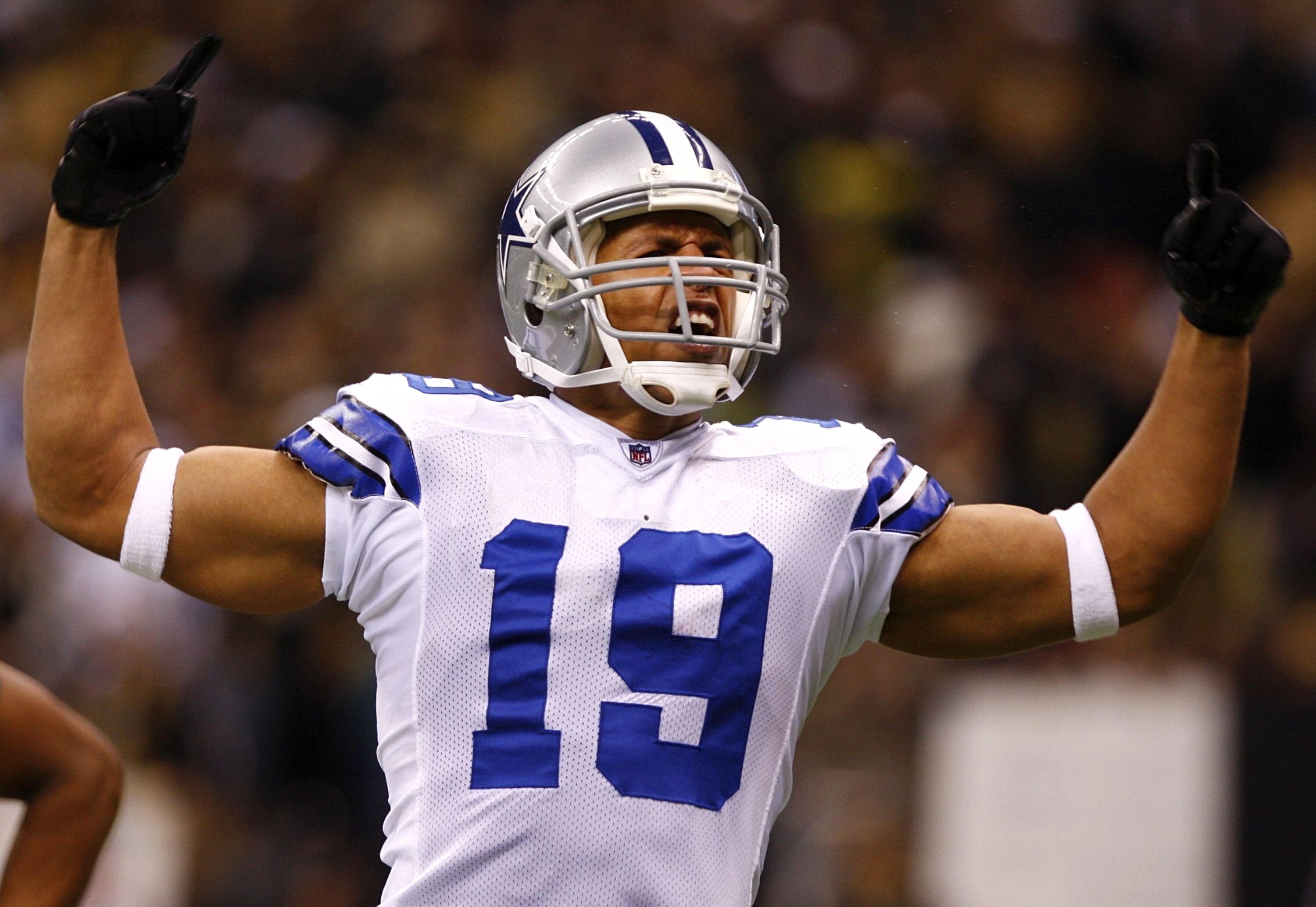 NEW ORLEANS - DECEMBER 19:  Wide receiver Miles Austin #19 of the Dallas Cowboys celebrates after scoring a touchdown against the New Orleans Saints at the Louisiana Superdome on December 19, 2009 in New Orleans, Louisiana. (Photo by Scott Halleran/Getty