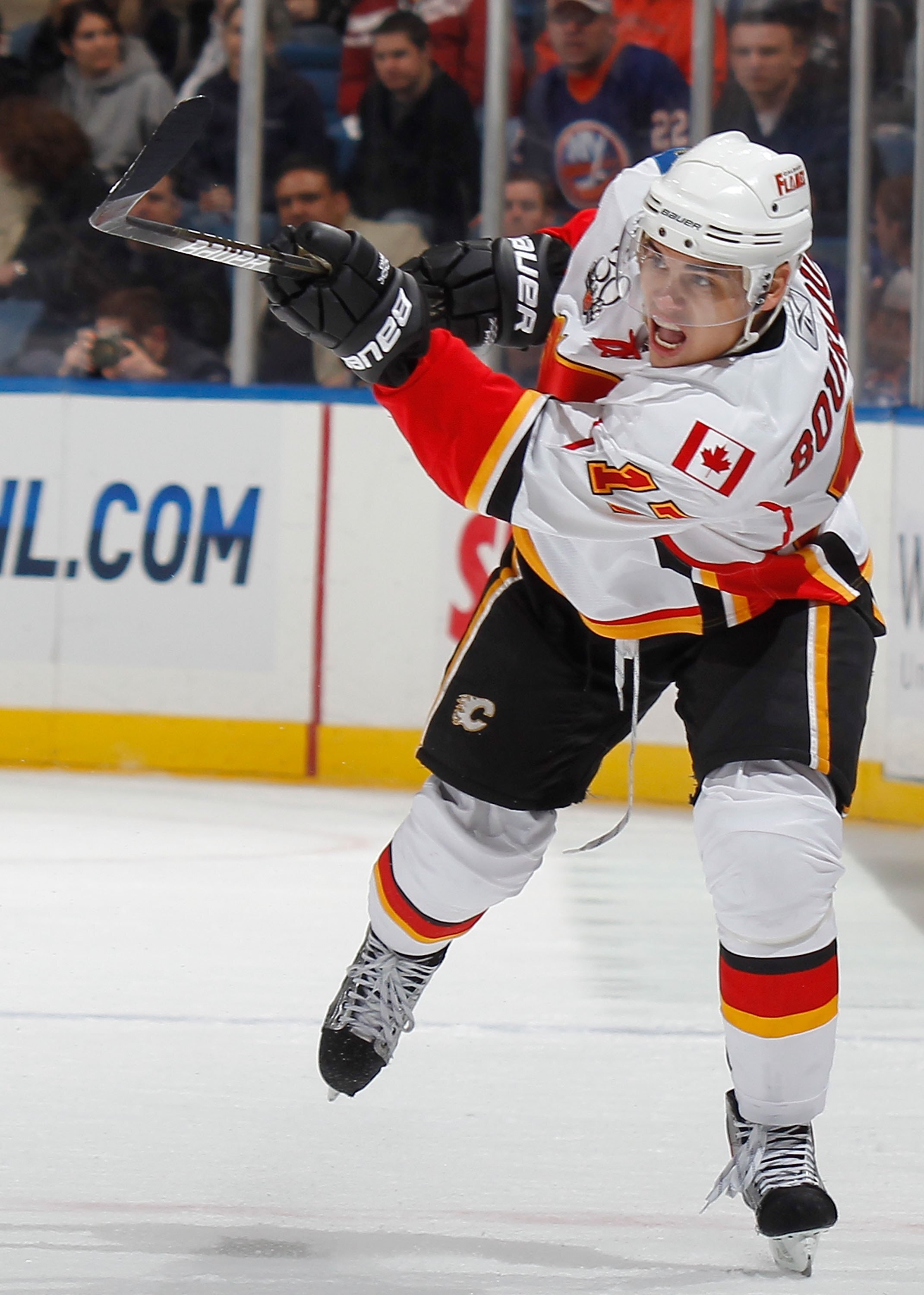 UNIONDALE, NY - MARCH 25:  Rene Bourque #17 of the Calgary Flames shoots the puck ahead against the New York Islanders during an NHL game at the Nassau Coliseum on March 25, 2010 in Uniondale, New York.  (Photo by Paul Bereswill/Getty Images)