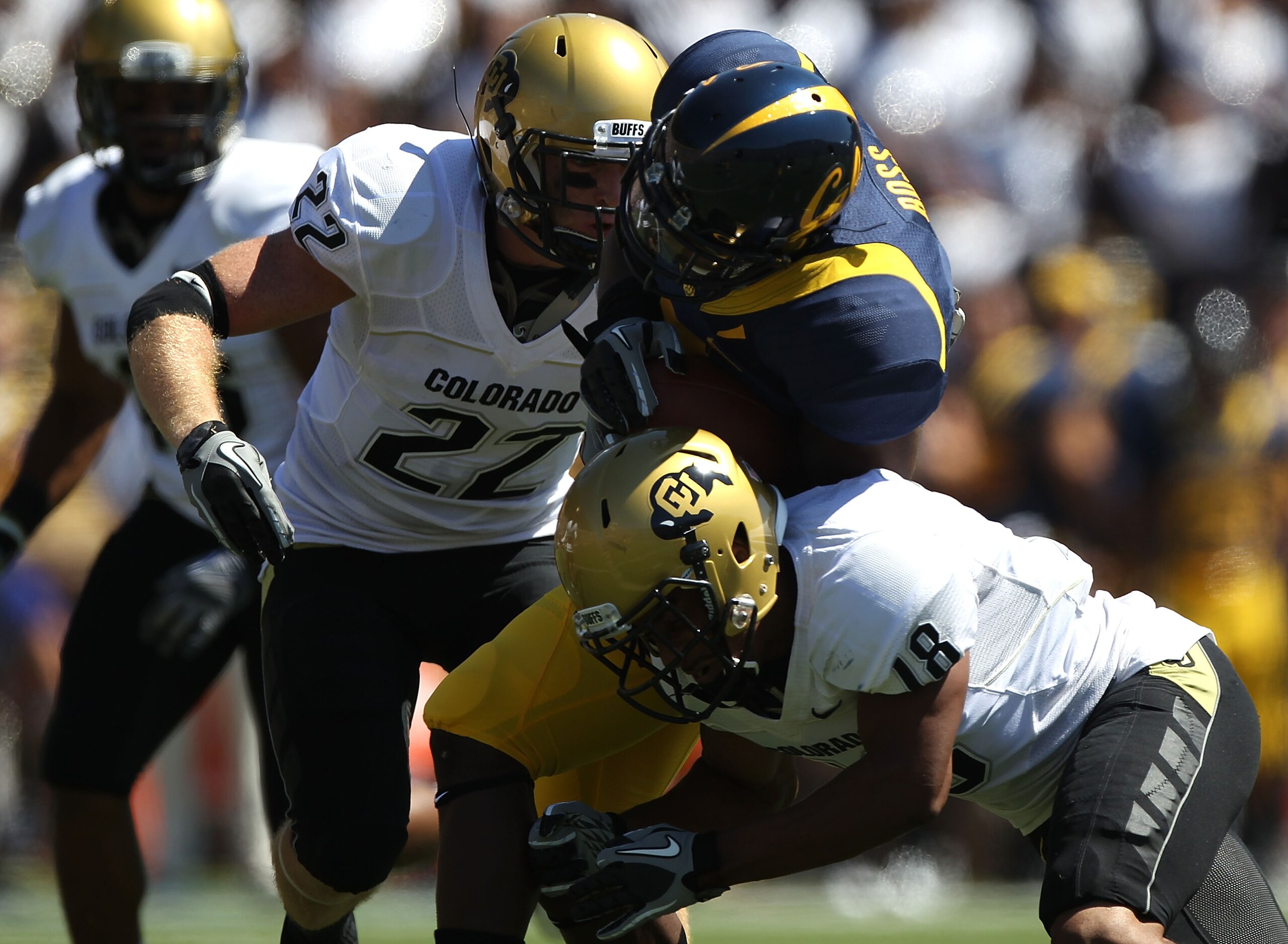 BERKELEY, CA - SEPTEMBER 11:  Jeremy Ross #3 of the California Golden Bears runs against Jonathan Hawkins #18 and Arthur Jaffee #22 of the Colorado Buffaloes at California Memorial Stadium on September 11, 2010 in Berkeley, California.  (Photo by Jed Jaco