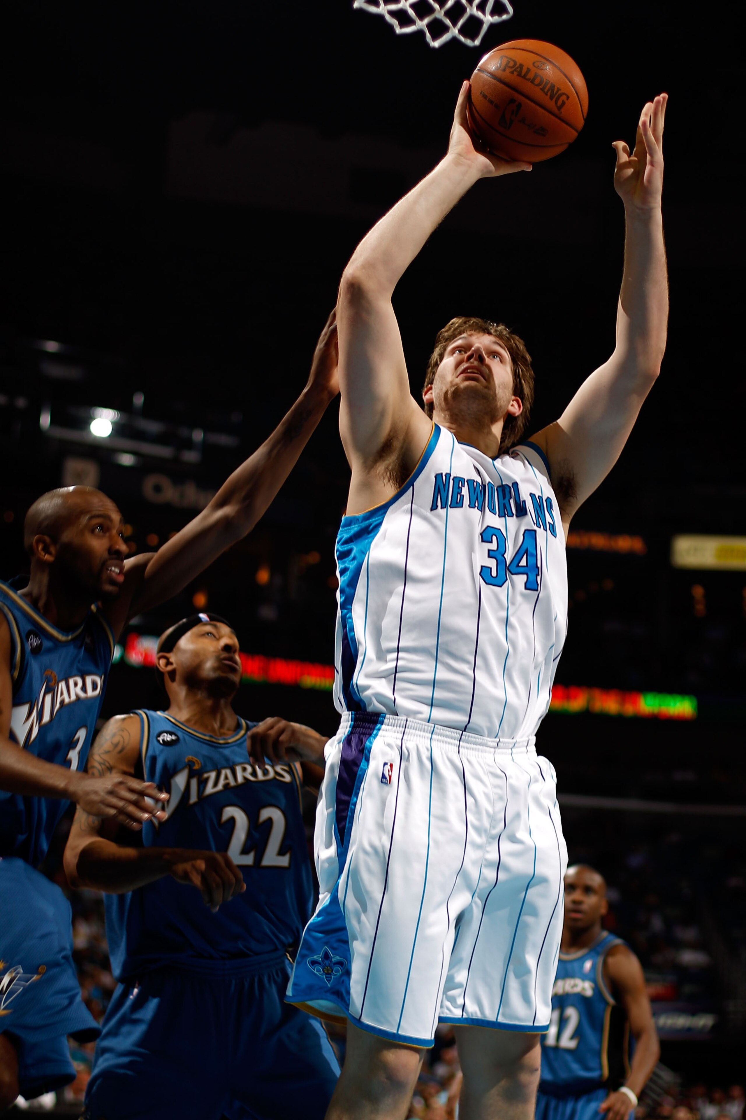 NEW ORLEANS - MARCH 31:  Aaron Gray #34 of the New Orleans Hornets shoots the ball over Quinton Ross #3 of the Washington Wizards at New Orleans Arena on March 31, 2010 in New Orleans, Louisiana.  The Wizards defeated the Hornets 96-91.  NOTE TO USER: Use