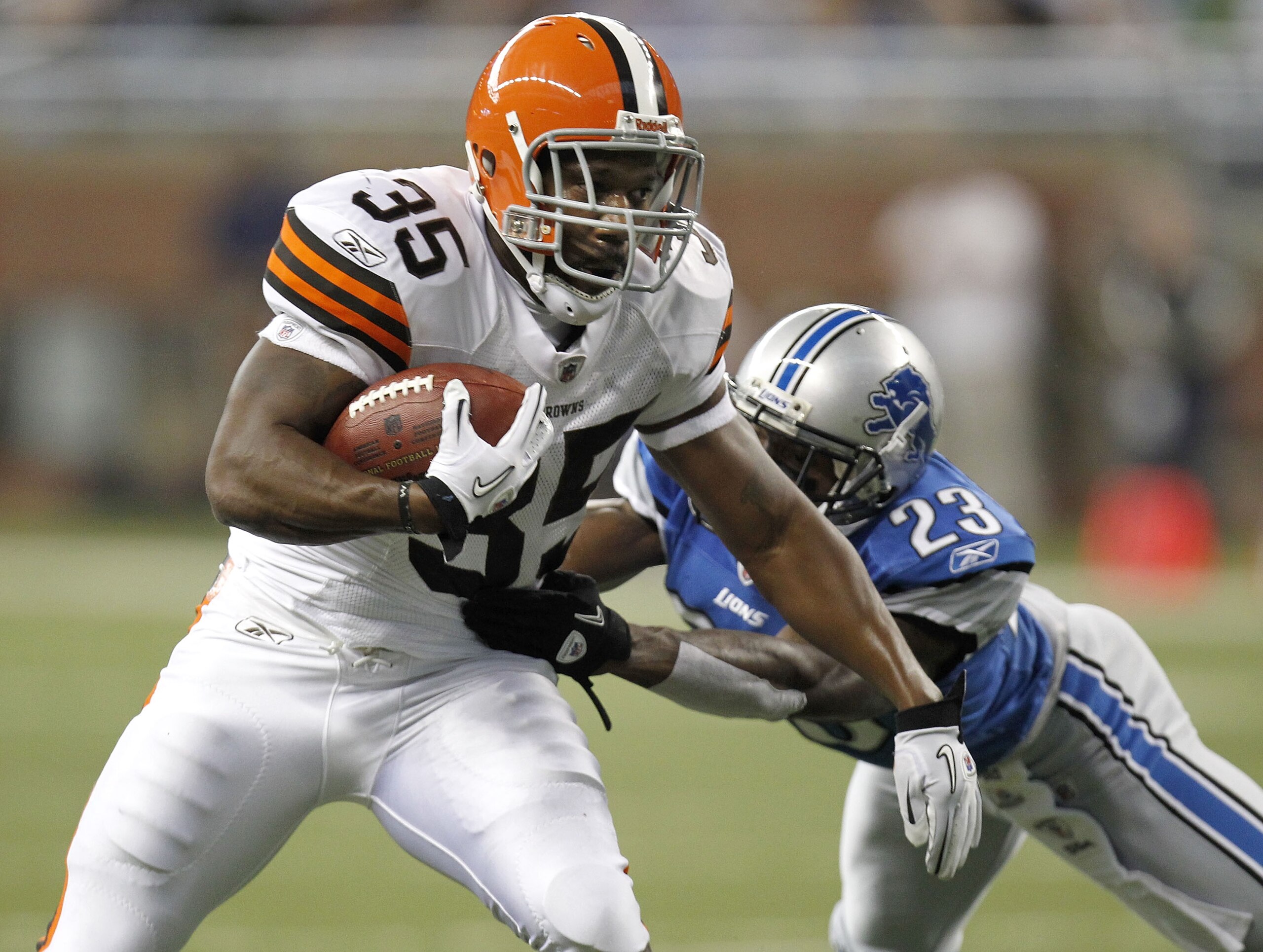 DETROIT - AUGUST 28: Jerome Harrison #35 of the Cleveland Browns tries to escape the tackle of Chris Houston #23 of the Detroit Lions during preseason game on August 28, 2010 at Ford Field in Detroit, Michigan. (Photo by Gregory Shamus/Getty Images) DETROIT - AUGUST 28: Jerome Harrison #35 of the Cleveland Browns tries to escape the tackle of Chris Houston #23 of the Detroit Lions during preseason game on August 28, 2010 at Ford Field in Detroit, Michigan. (Photo by Gregory Shamus/Getty Images)