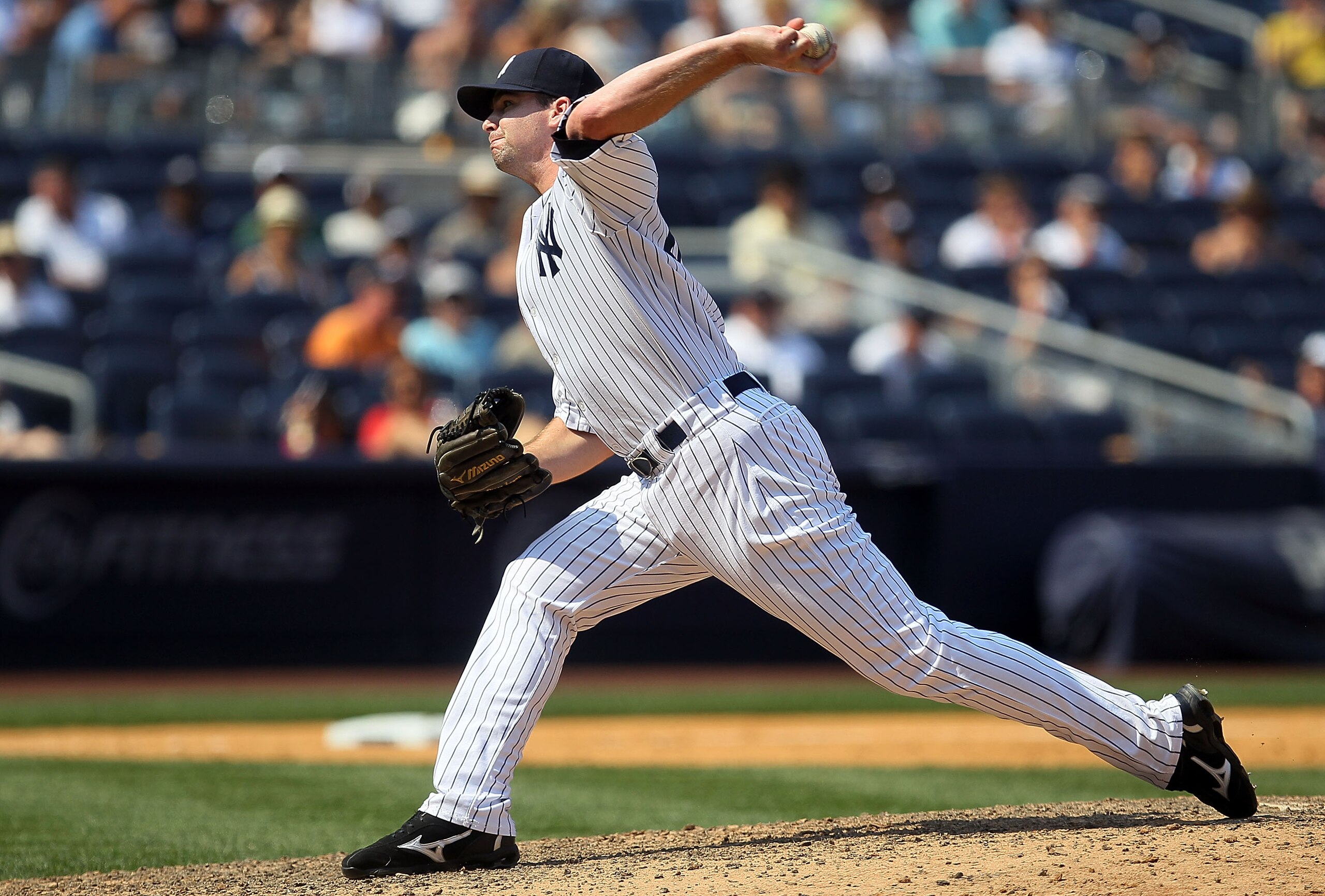 NEW YORK - JULY 18:  Boone Logan #48 of the New York Yankees delivers a pitch against the Tampa Bay Rays on July 18, 2010 at Yankee Stadium in the Bronx borough of New York City. The Yankees defeated the Rays 9-5.  (Photo by Jim McIsaac/Getty Images)