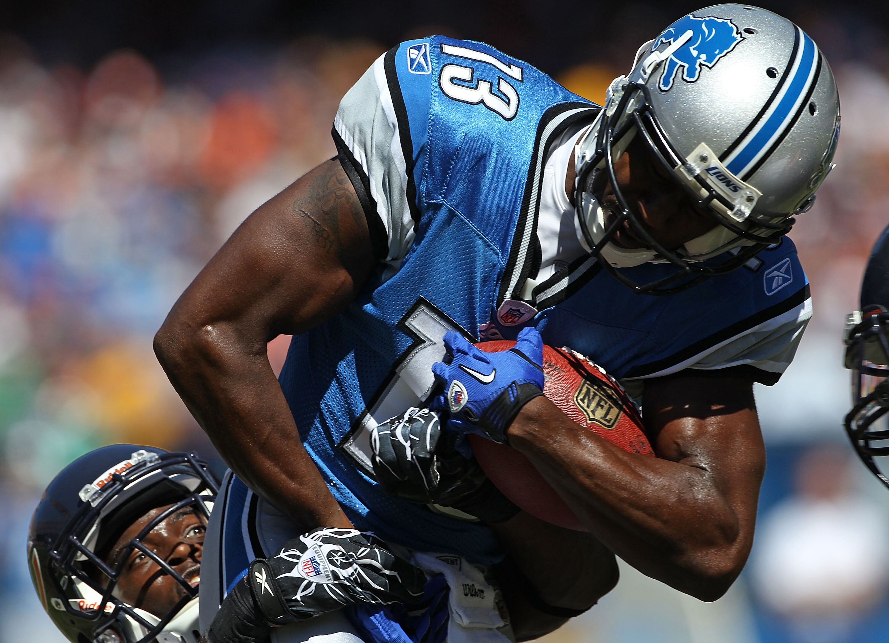 CHICAGO - SEPTEMBER 12: Nate Burleson #13 of the Detroit Lions is slowed by Zack Bowman #35 of the Chicago Bears during the NFL season opening game at Soldier Field on September 12, 2010 in Chicago, Illinois. The Bears defeated the Lions 19-14. (Photo by