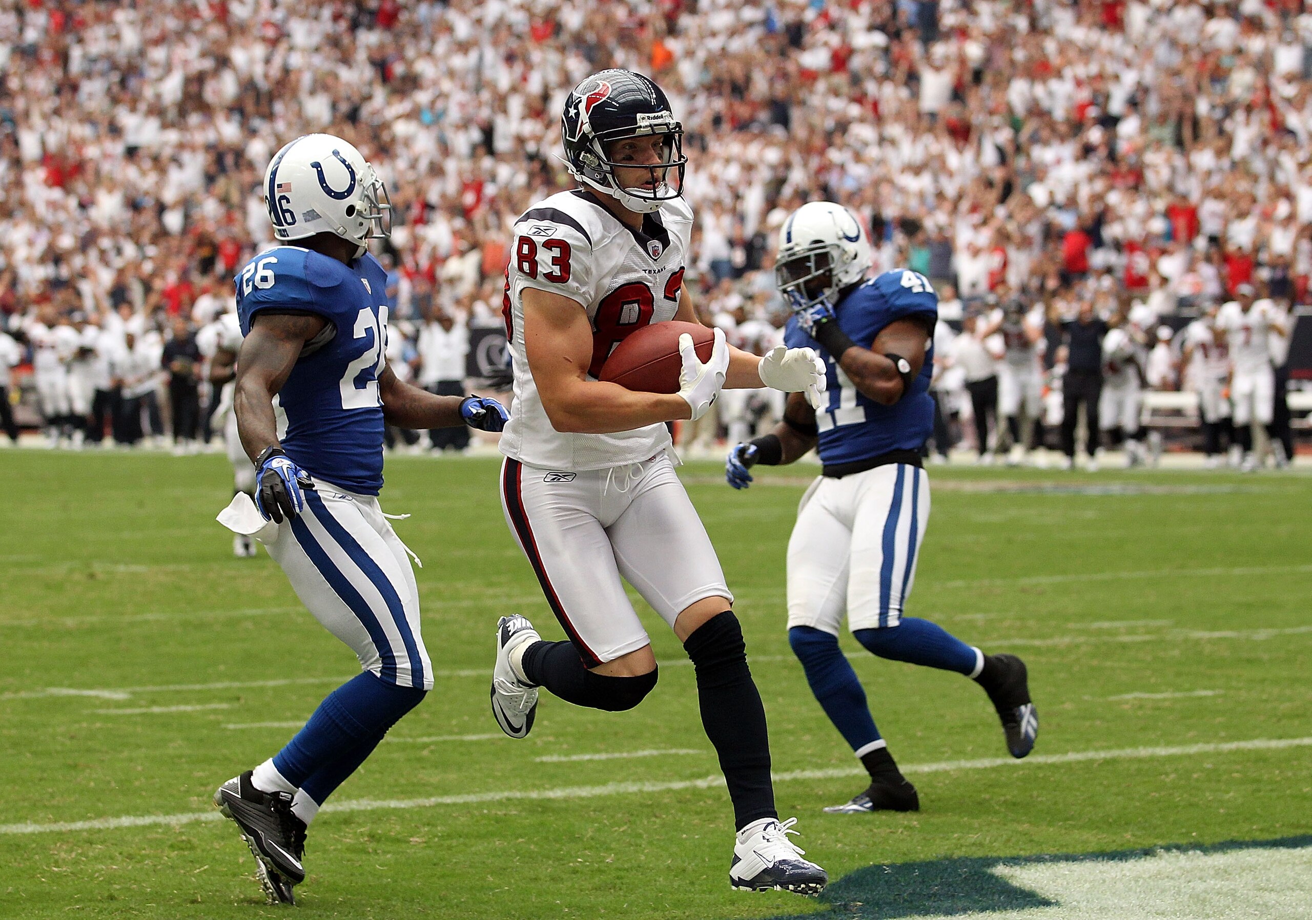HOUSTON - SEPTEMBER 12: Wide receiver Kevin Walter #83 of the Houston Texans runs for a touchdown past Kelvin Hayden #26 of the Indianapolis Colts during the NFL season opener at Reliant Stadium on September 12, 2010 in Houston, Texas. (Photo by Ronald HOUSTON - SEPTEMBER 12: Wide receiver Kevin Walter #83 of the Houston Texans runs for a touchdown past Kelvin Hayden #26 of the Indianapolis Colts during the NFL season opener at Reliant Stadium on September 12, 2010 in Houston, Texas. (Photo by Ronald