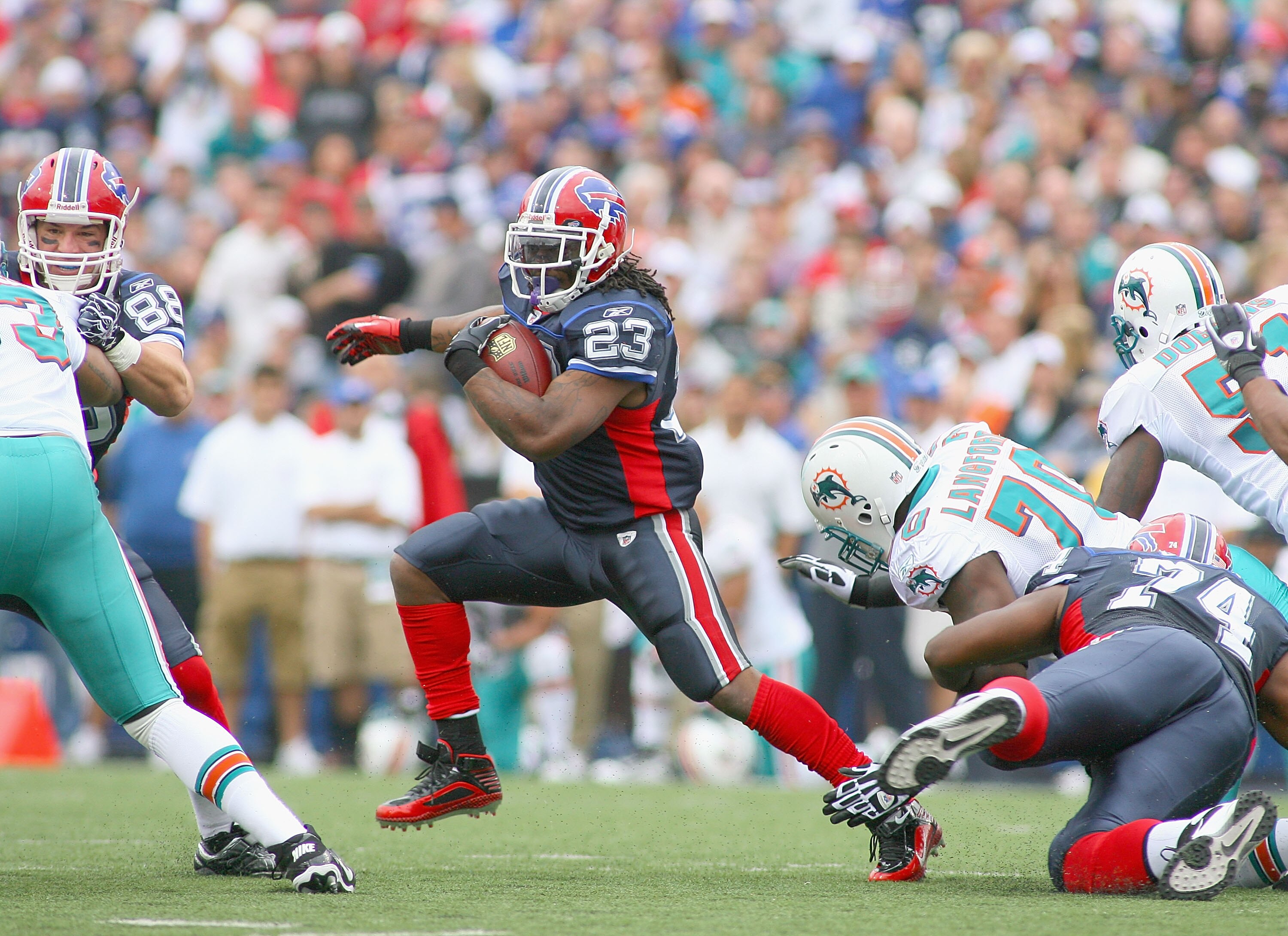 ORCHARD PARK, NY - SEPTEMBER 12: Marshawn Lynch #23 of the Buffalo Bills runs against the Miami Dolphins during the NFL season opener at Ralph Wilson Stadium on September 12, 2010 in Orchard Park, New York. Miami won 15-10. (Photo by Rick Stewart/Getty Im