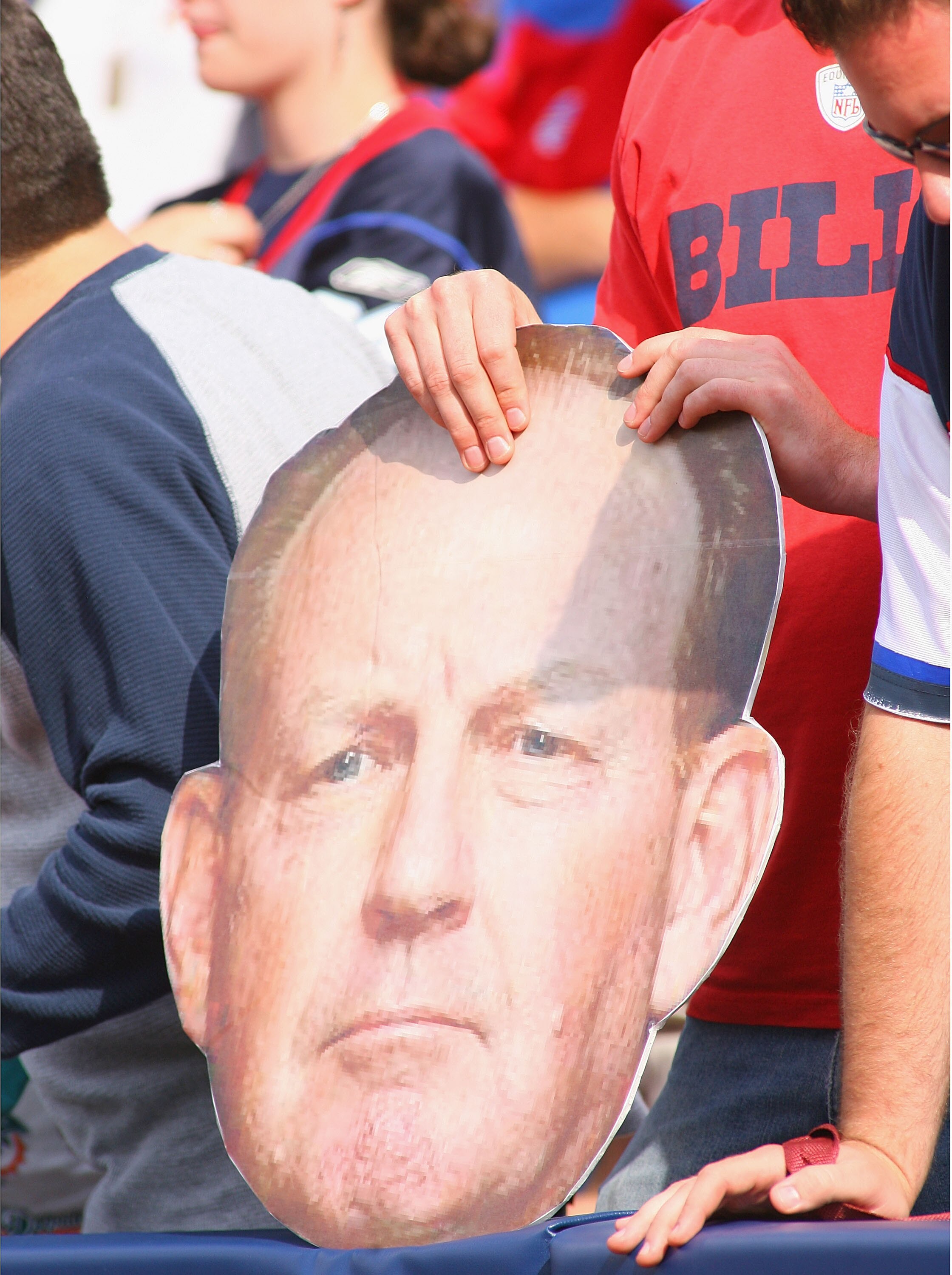 ORCHARD PARK, NY - SEPTEMBER 12: A Buffalo Bills fan holds a board with the head of Bills head coach Chan Gailey's face during the NFL season opener against the Miami Dolphins at Ralph Wilson Stadium on September 12, 2010 in Orchard Park, New York. Miami