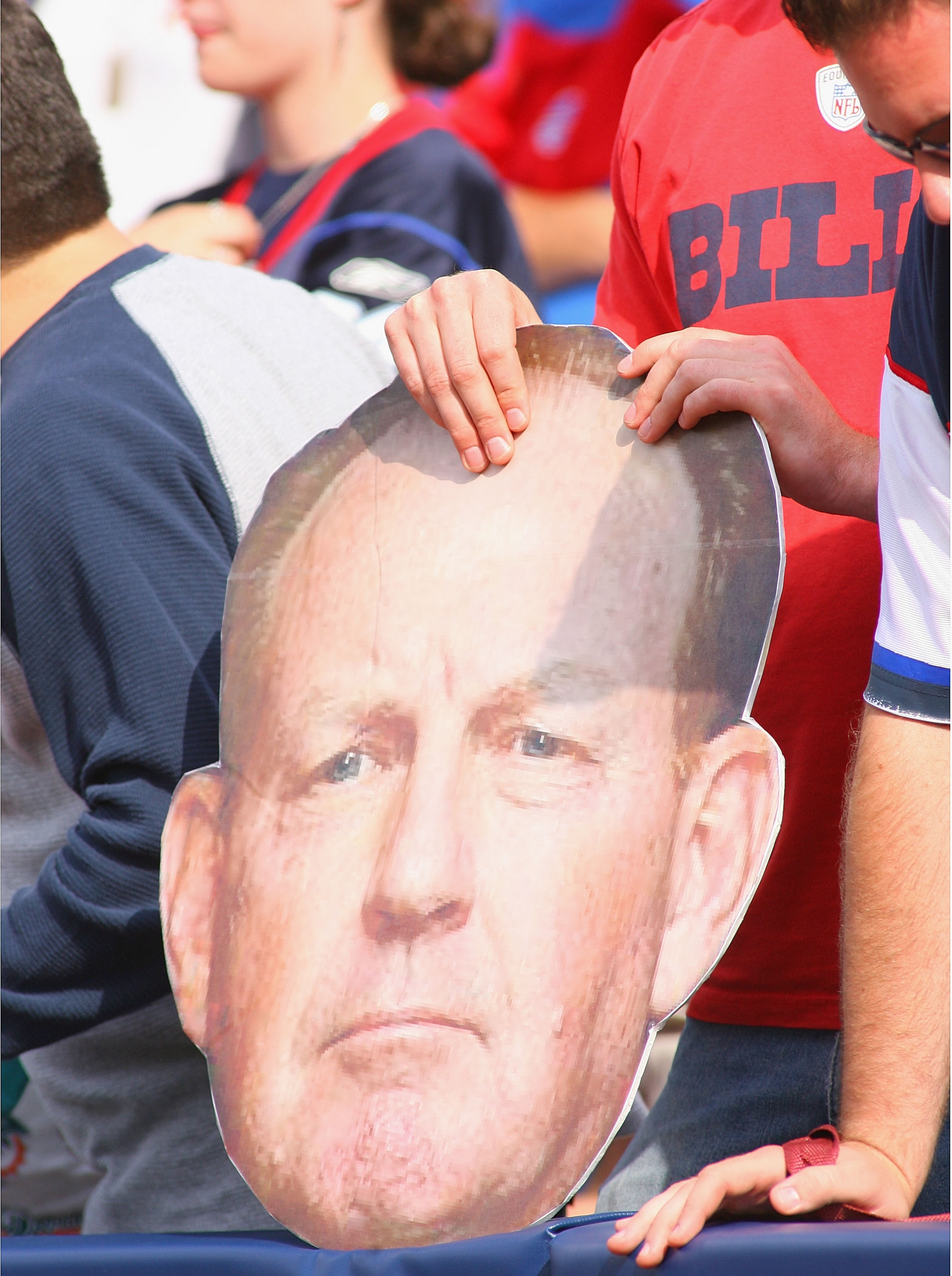 ORCHARD PARK, NY - SEPTEMBER 12: A Buffalo Bills fan holds a board with the head of Bills head coach Chan Gailey's face during the NFL season opener against the Miami Dolphins at Ralph Wilson Stadium on September 12, 2010 in Orchard Park, New York. Miami ORCHARD PARK, NY - SEPTEMBER 12: A Buffalo Bills fan holds a board with the head of Bills head coach Chan Gailey's face during the NFL season opener against the Miami Dolphins at Ralph Wilson Stadium on September 12, 2010 in Orchard Park, New York. Miami