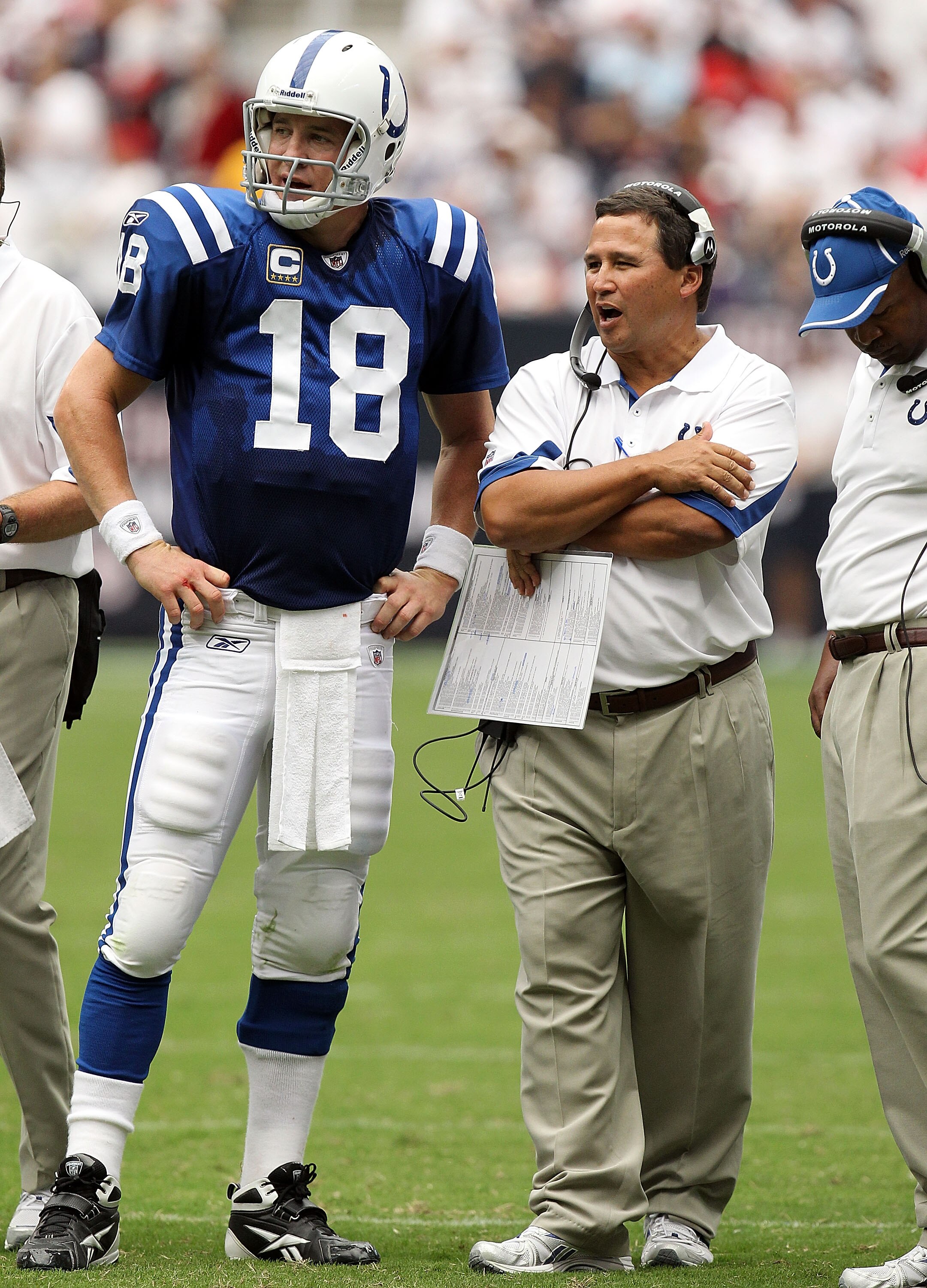 HOUSTON - SEPTEMBER 12:  Offensive coordinator Clyde Christensen talks with Peyton Manning #18 of the Indianapolis Colts at Reliant Stadium on September 12, 2010 in Houston, Texas.  (Photo by Ronald Martinez/Getty Images)