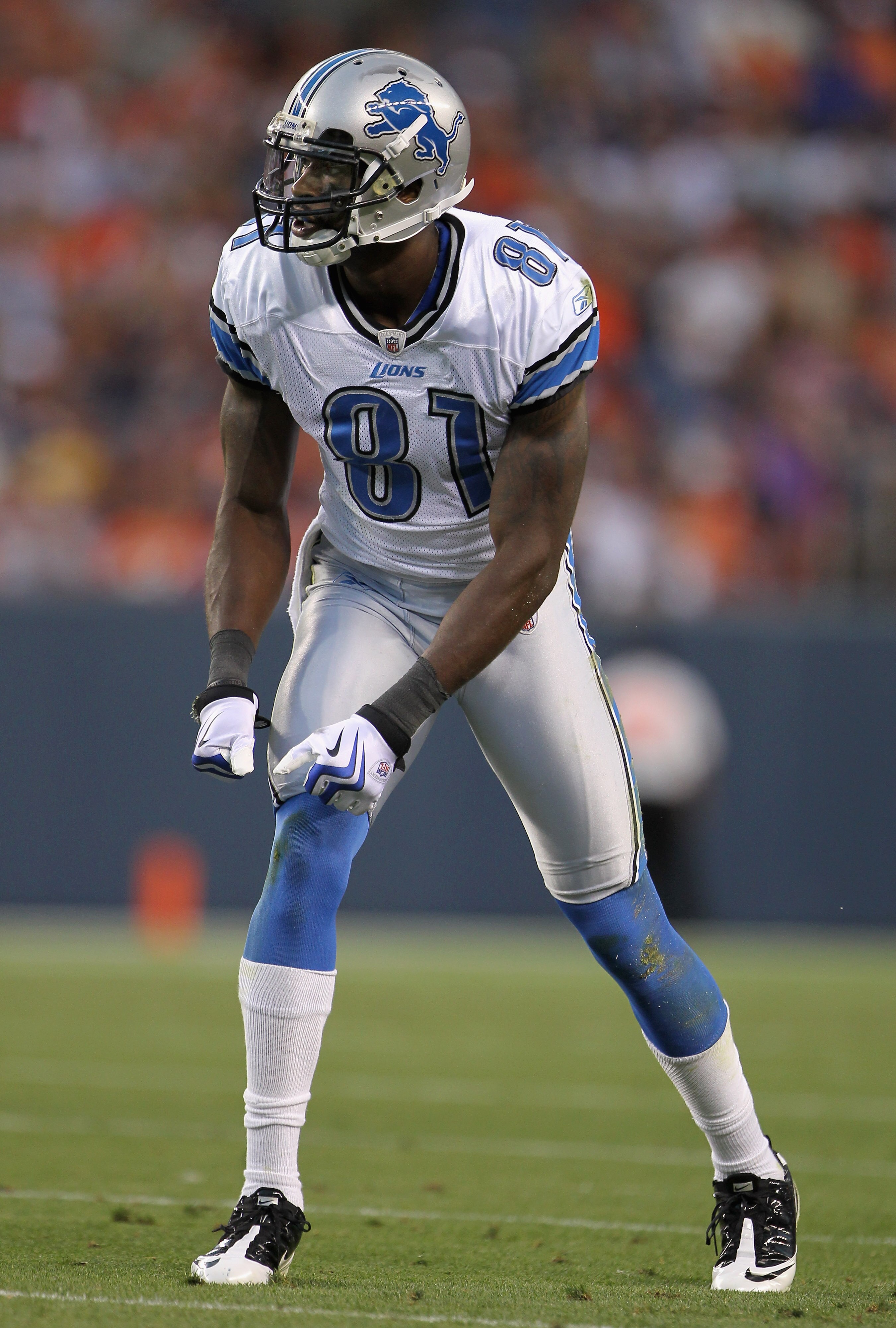 DENVER - AUGUST 21:  Wide receiver Calvin Johnson #81 of the Detroit Lions awaits the snap on the line of scrimmage against the Denver Broncos during preseason NFL action at INVESCO Field at Mile High on August 21, 2010 in Denver, Colorado. The Lions defe