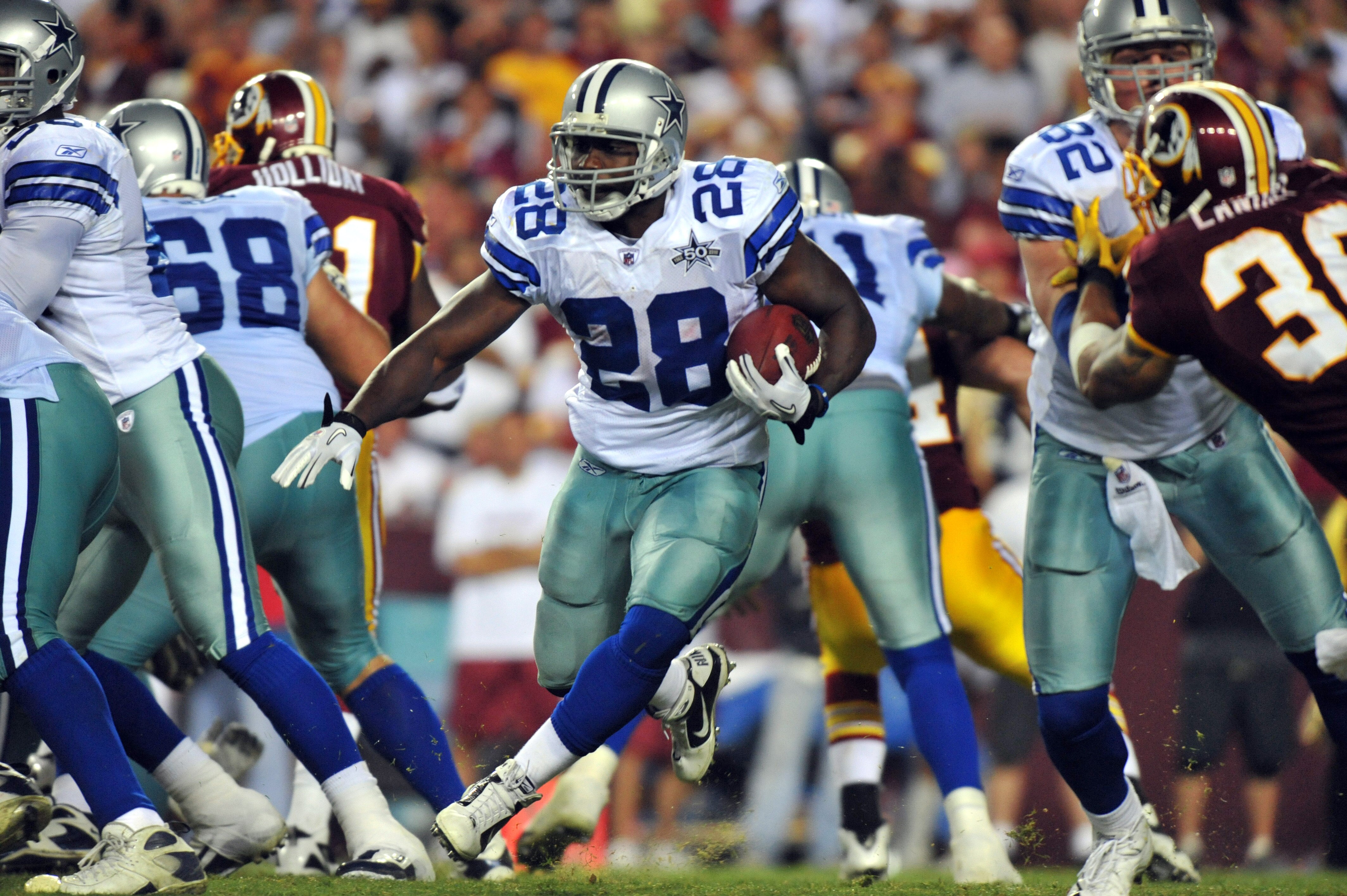 LANDOVER - SEPTEMBER 12:  Felix Jones #28 of the Dallas Cowboys runs the ball during the NFL season opener against the Washington Redskins at FedExField on September 12, 2010 in Landover, Maryland. The Redskins defeated the Cowboys 13-7. (Photo by Larry F