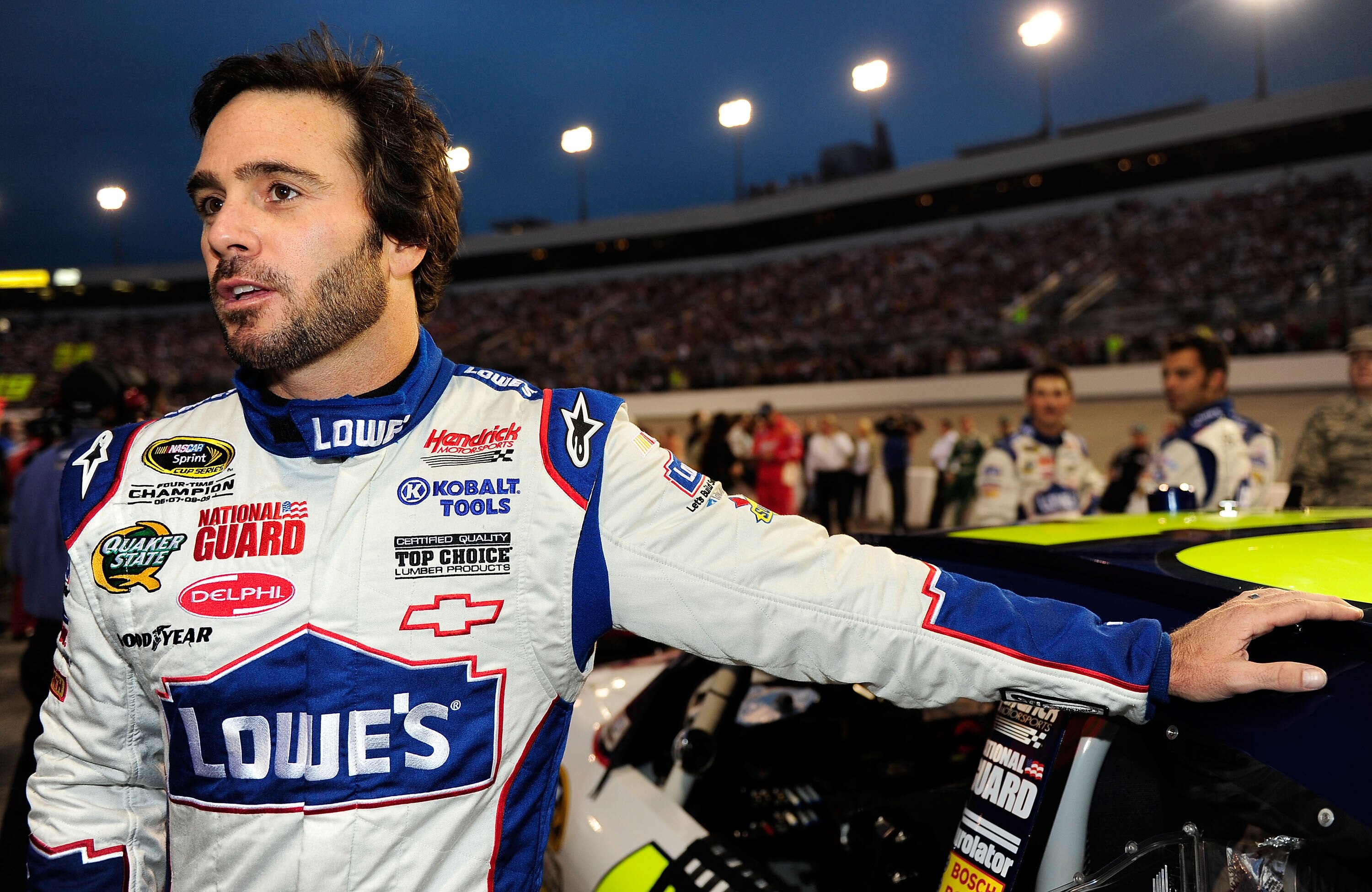 RICHMOND, VA - SEPTEMBER 11:  Jimmie Johnson, driver of the #48 Lowe's Chevrolet,  stands on the grid prior to the start of the NASCAR Sprint Cup Series Air Guard 400 at Richmond International Raceway on September 11, 2010 in Richmond, Virginia.  (Photo b