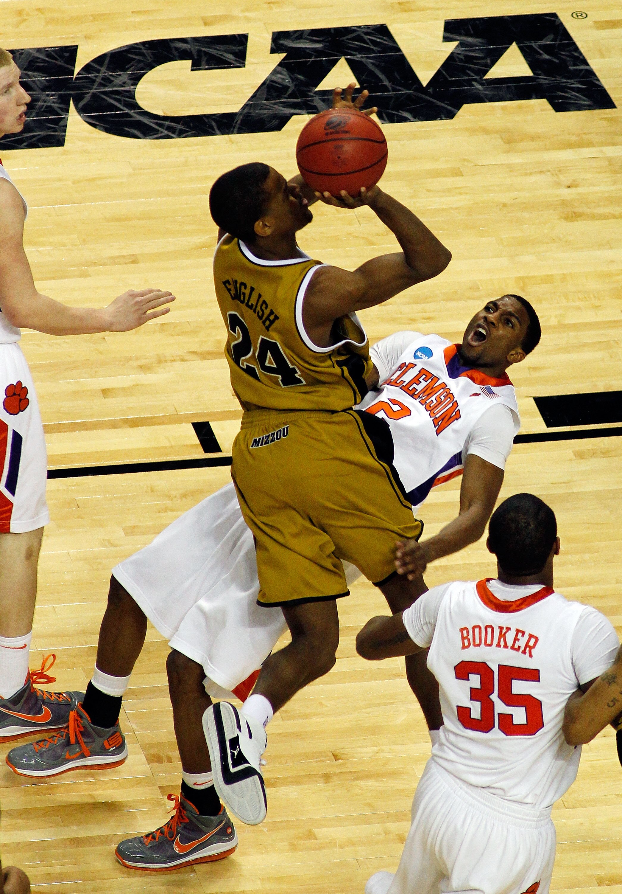 BUFFALO, NY - MARCH 19:  Demontez Stitt #2 of the Clemson Tigers draws the charge against Kim English #24 of the Missouri Tigers during the first round of the 2010 NCAA men's basketball tournament at HSBC Arena on March 19, 2010 in Buffalo, New York.  (Ph