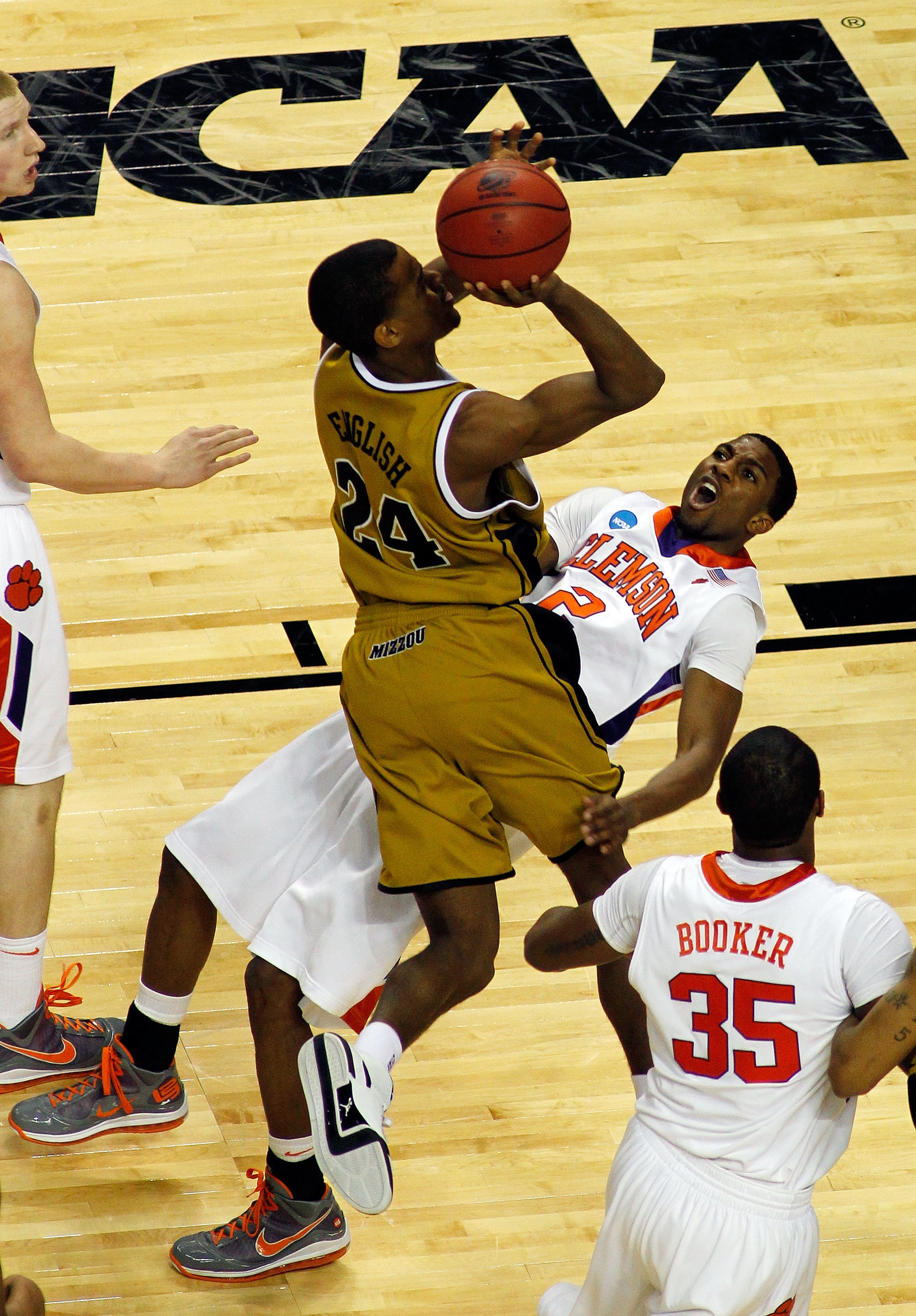 BUFFALO, NY - MARCH 19:  Demontez Stitt #2 of the Clemson Tigers draws the charge against Kim English #24 of the Missouri Tigers during the first round of the 2010 NCAA men's basketball tournament at HSBC Arena on March 19, 2010 in Buffalo, New York.  (Ph