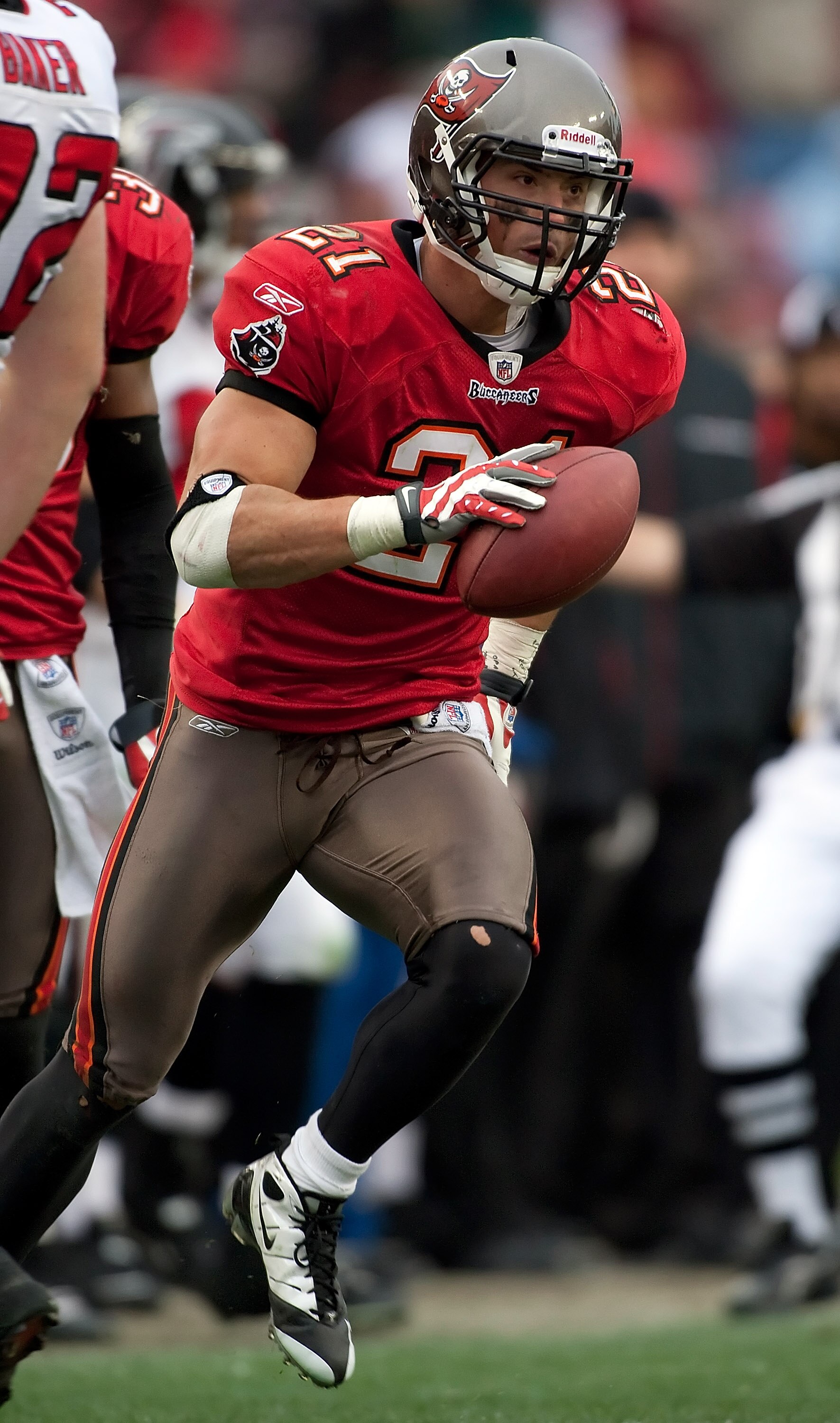 TAMPA, FL - JANUARY 03:  Safety Sabby Piscitelli #21 of the Tampa Bay Buccaneers intercepts a pass against the Atlanta Falcons during the game at Raymond James Stadium on January 3, 2010 in Tampa, Florida.  (Photo by J. Meric/Getty Images)