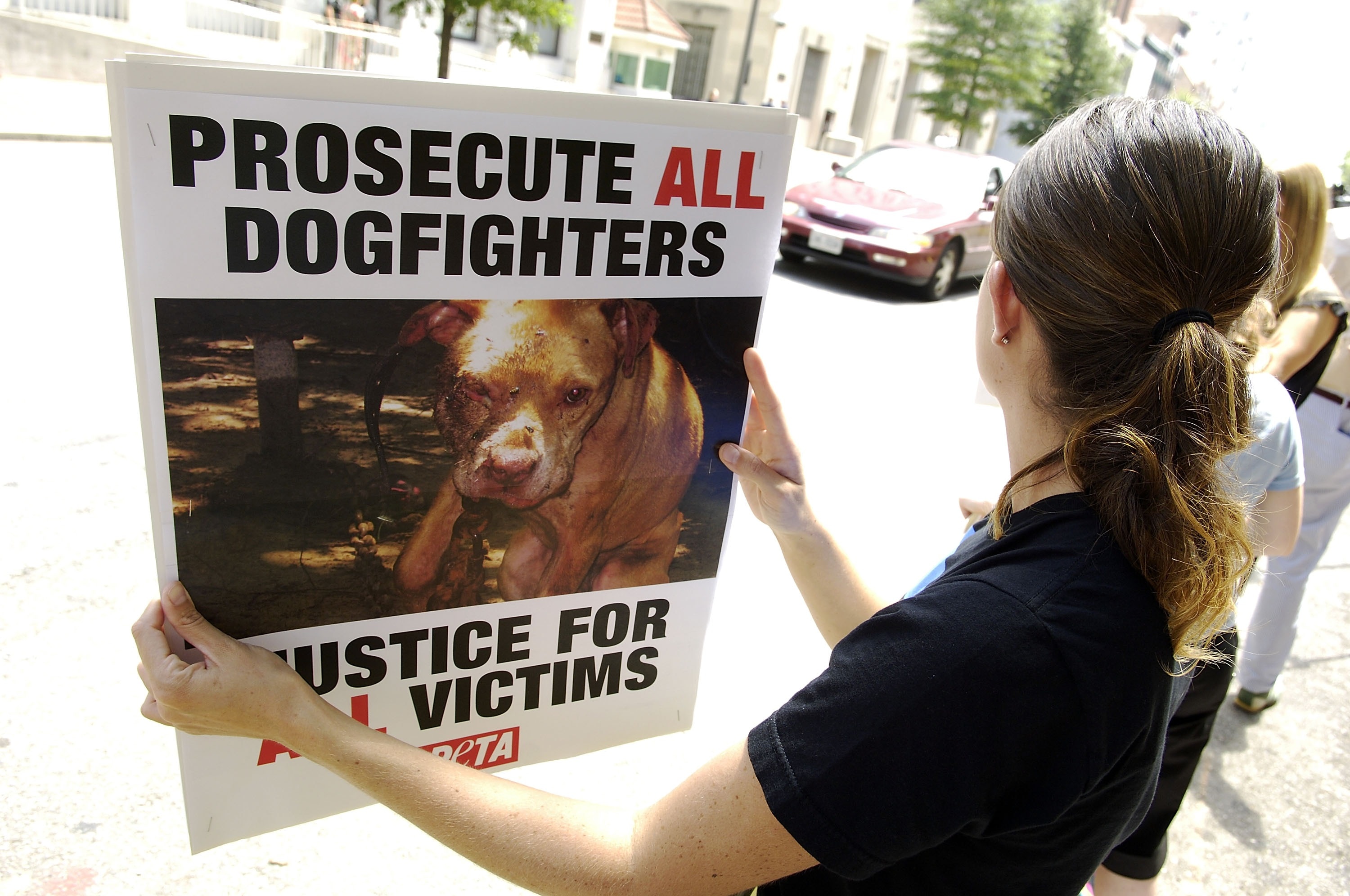 RICHMOND, VA - JULY 26:  Protestors from People for the Ethical Treatment of Animals carry signs as they wait for Atlanta Falcons quarterback Michael Vick to appear for a bond hearing and arraignment in federal court July 26, 2007 in Richmond, Virginia. V