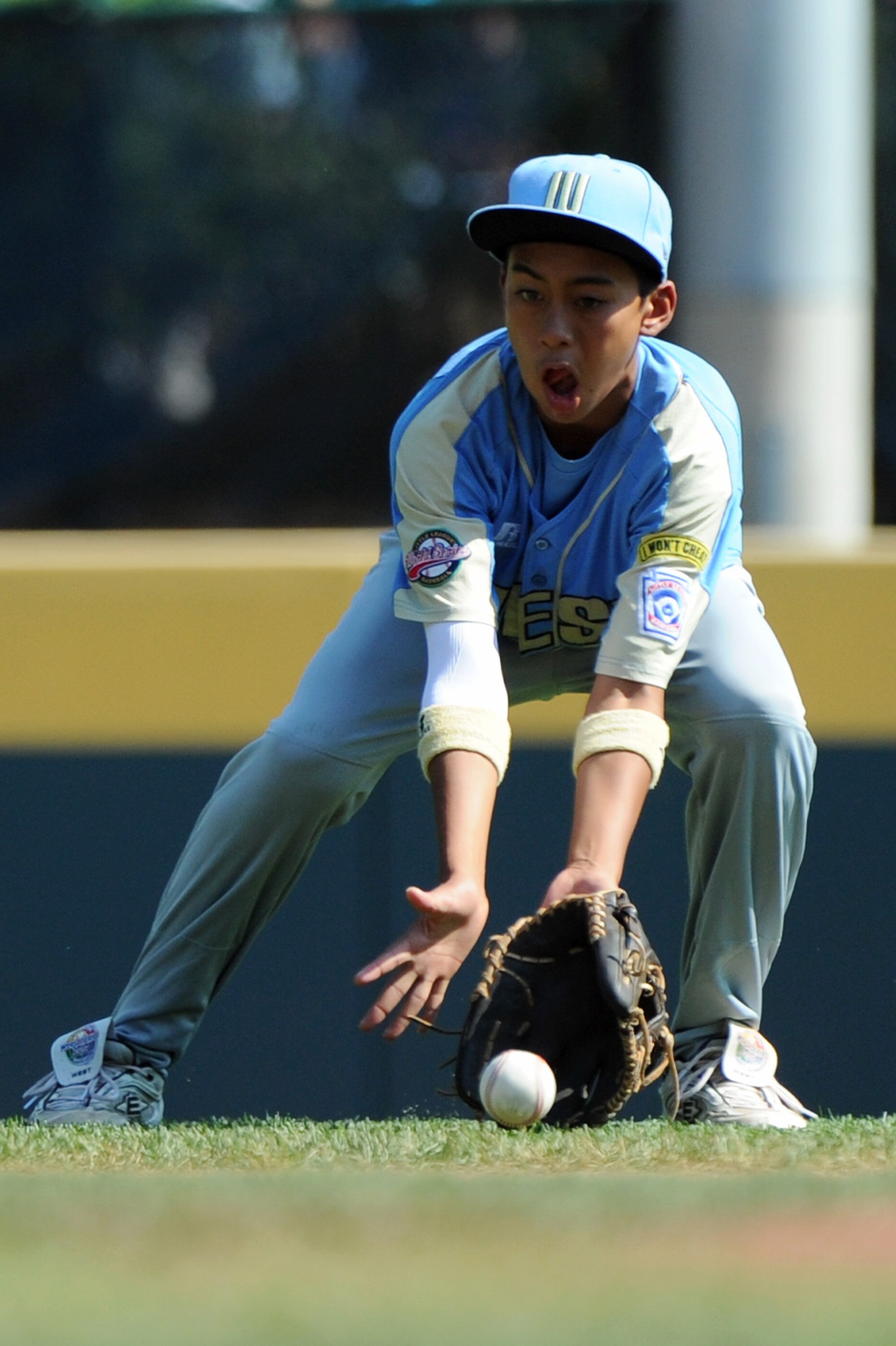 SOUTH WILLAMSPORT, PA - AUGUST 29:  Justice Nakagawa #10 of the United States Little League team fields a ground ball during the game against Japan on August 29, 2010 in South Willamsport, Pennsylvania. Japan went on to win the Little League World Series
