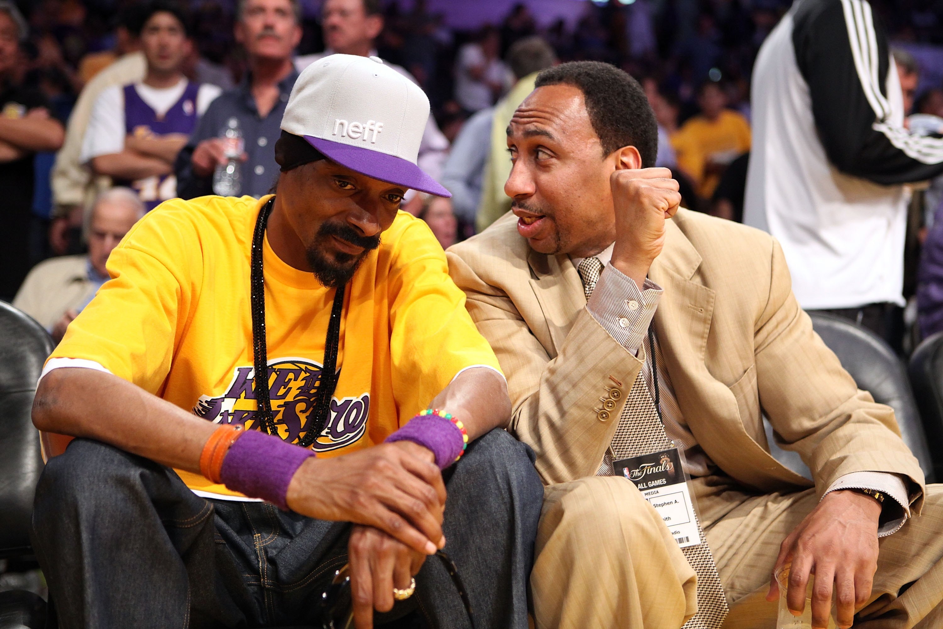LOS ANGELES, CA - JUNE 15:  Rapper Snoop Dogg talks with radio host Stephen A. Smith as they sits courtside in Game Six of the 2010 NBA Finals between the Boston Celtics and the Los Angeles Lakers at Staples Center on June 15, 2010 in Los Angeles, Califor