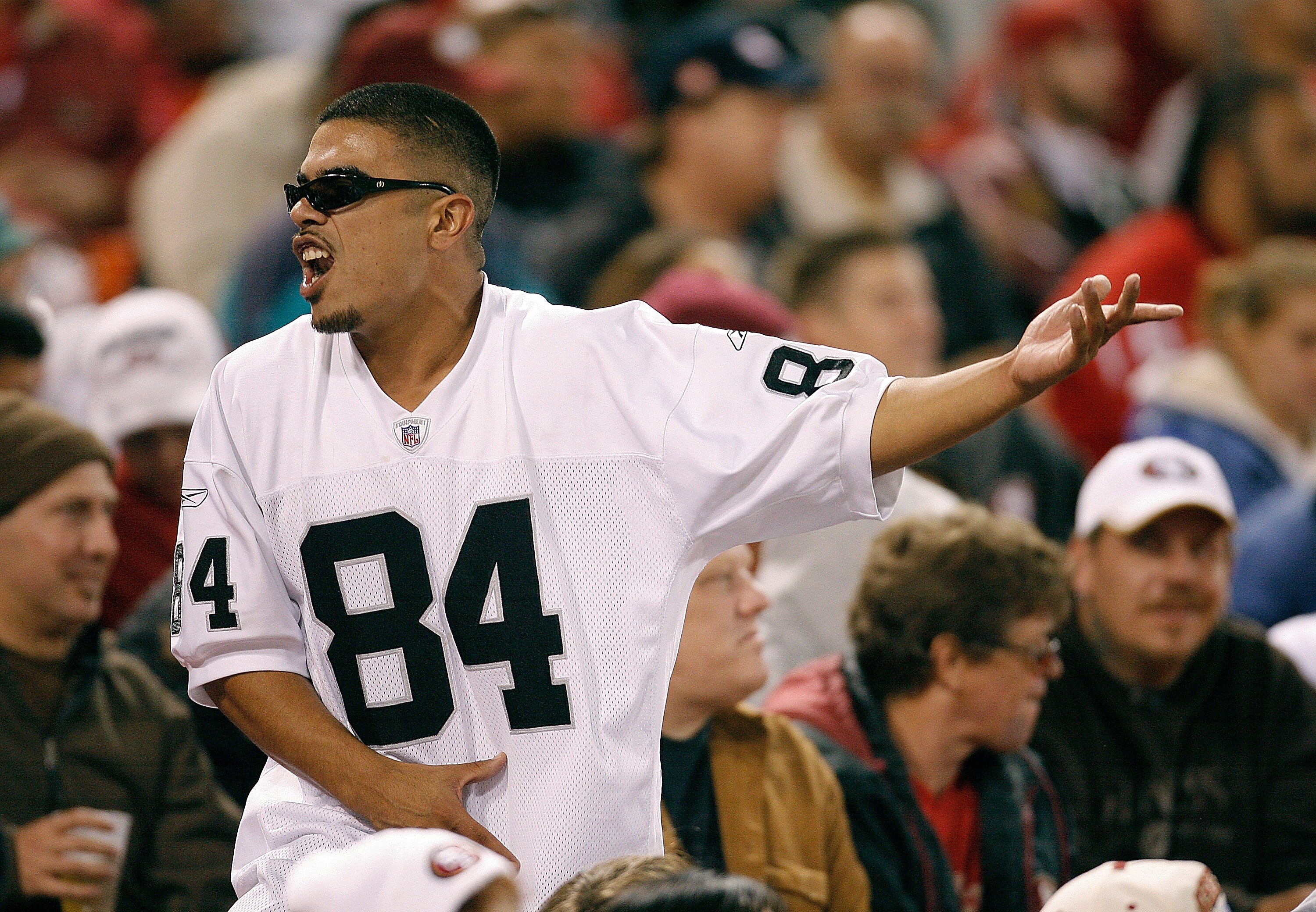 SAN FRANCISCO - AUGUST 18:  An Oakland Raiders fan celebrates a Raiders touchdown against the San Francisco 49ers during a pre-season game at Monster Park August 18, 2007 in San Francisco, California.  (Photo by Greg Trott/Getty Images)
