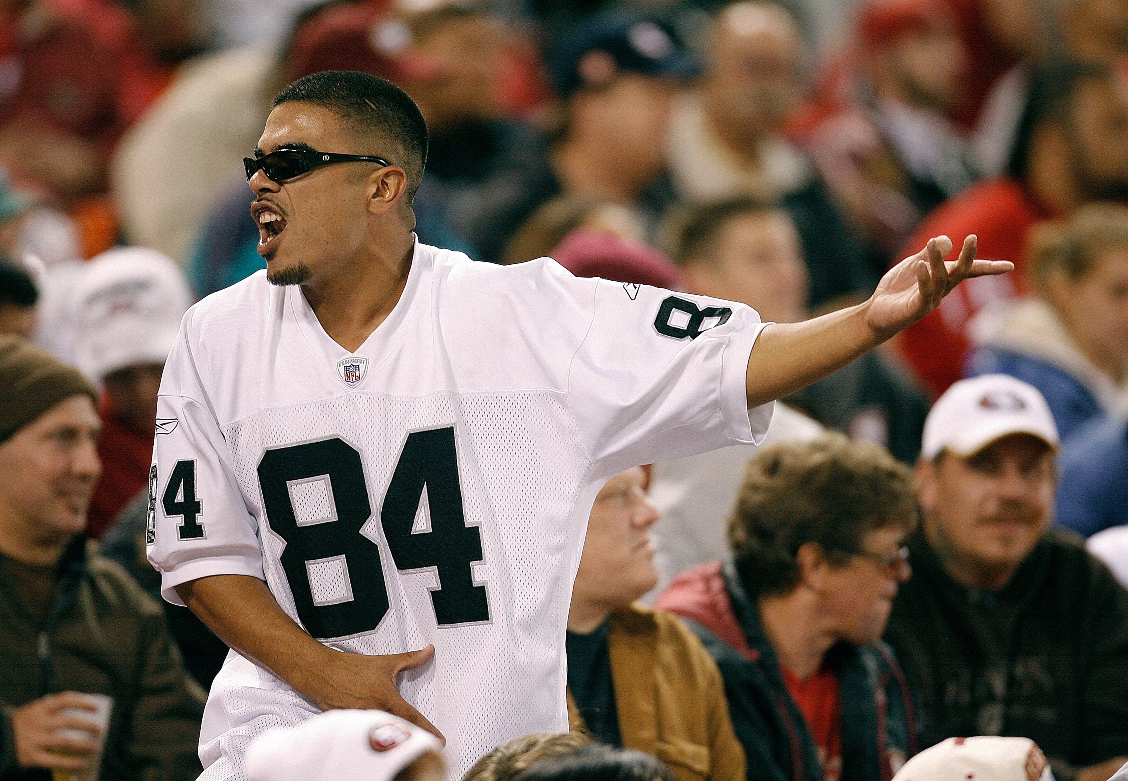 SAN FRANCISCO - AUGUST 18:  An Oakland Raiders fan celebrates a Raiders touchdown against the San Francisco 49ers during a pre-season game at Monster Park August 18, 2007 in San Francisco, California.  (Photo by Greg Trott/Getty Images)