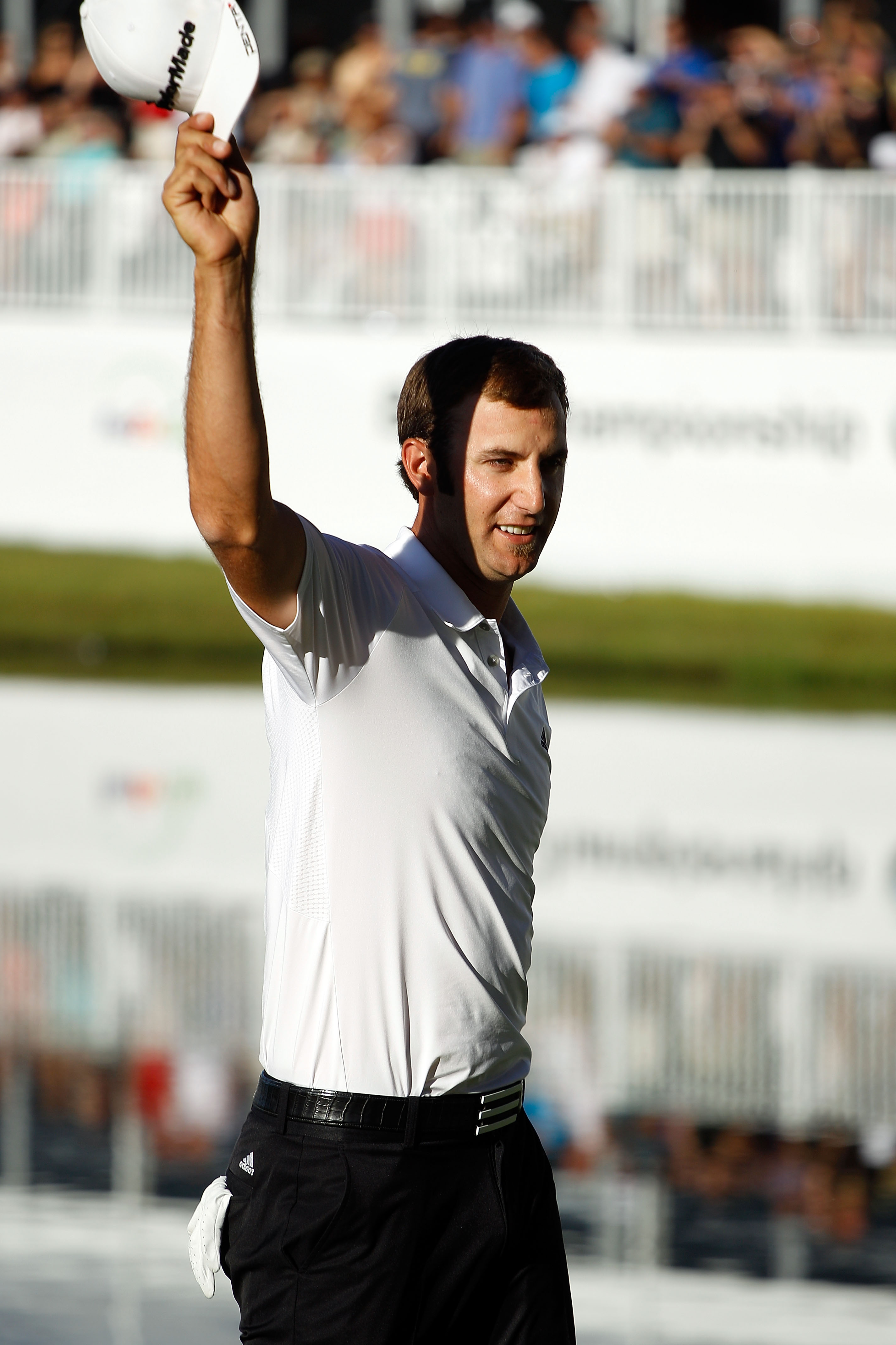 LEMONT, IL - SEPTEMBER 12:  Dustin Johnson reacts after making a putt on the 18th green to win the BMW Championship at Cog Hill Golf & Country Club on September 12, 2010 in Lemont, Illinois.  (Photo by Scott Halleran/Getty Images)