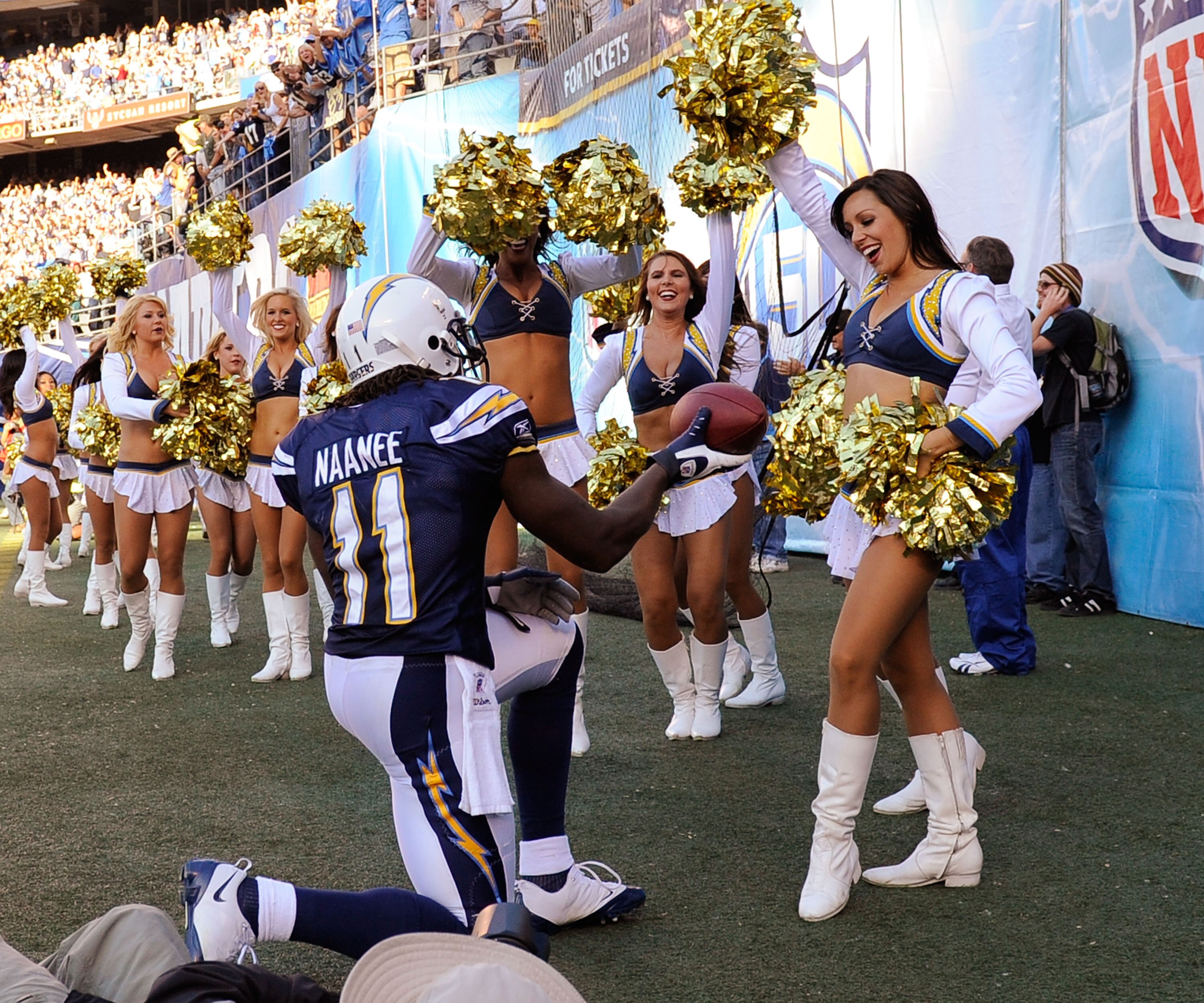 SAN DIEGO - NOVEMBER 15:  Legendu Naanee #11 of the San Diego Chargers offers the football to a Chargers cheerleader after a scoring a touchdown against the Philadelphia Eagles at Qualcomm Stadium on November 15, 2009 in San Diego, California.  (Photo by