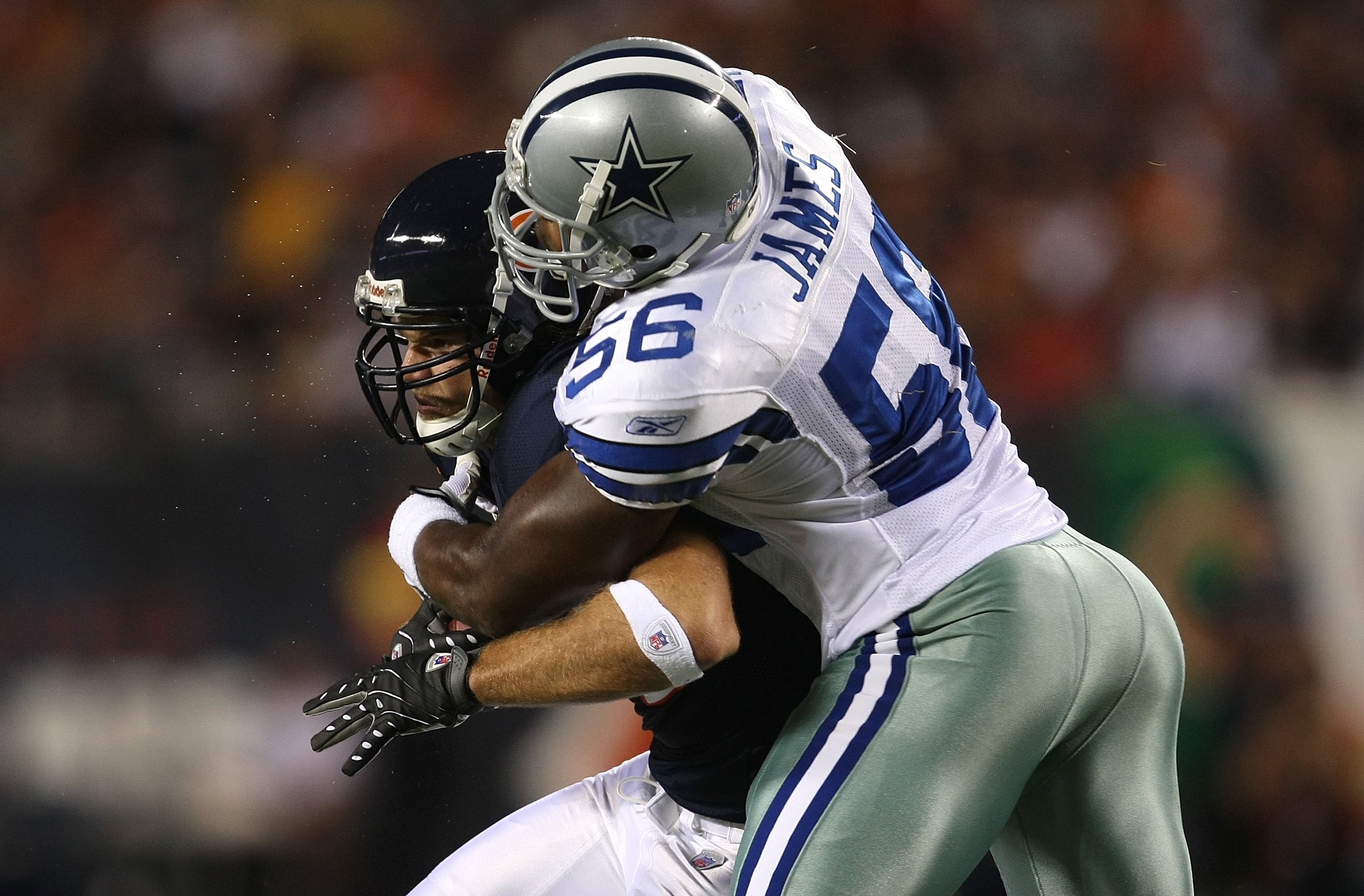 CHICAGO - SEPTEMBER 23:  Greg Olsen #82 of the Chicago Bears makes a reception against Bradie James #56 of the Dallas Cowboys at Soldier Field on September 23, 2007 in Chicago, Illinois. The Cowboys won 34-10.  (Photo by Jonathan Daniel/Getty Images)