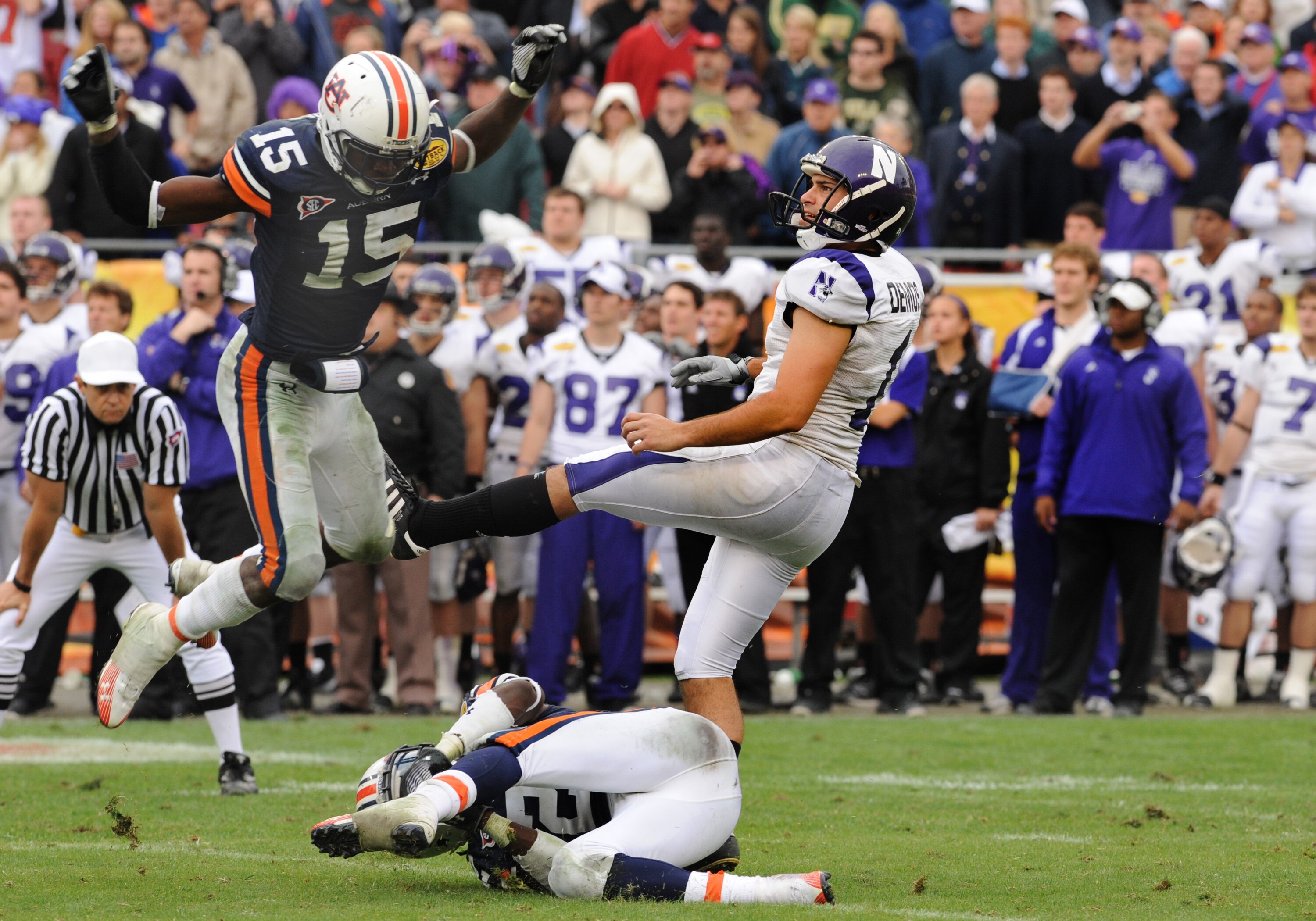 TAMPA, FL - JANUARY 1: Kicker Stefan Demos #1 of the Northwestern Wildcats follows through on a field goal attempt against the Auburn Tigers in the Outback Bowl January 1, 2010 at Raymond James Stadium in Tampa, Florida.  Auburn was called for roughing th
