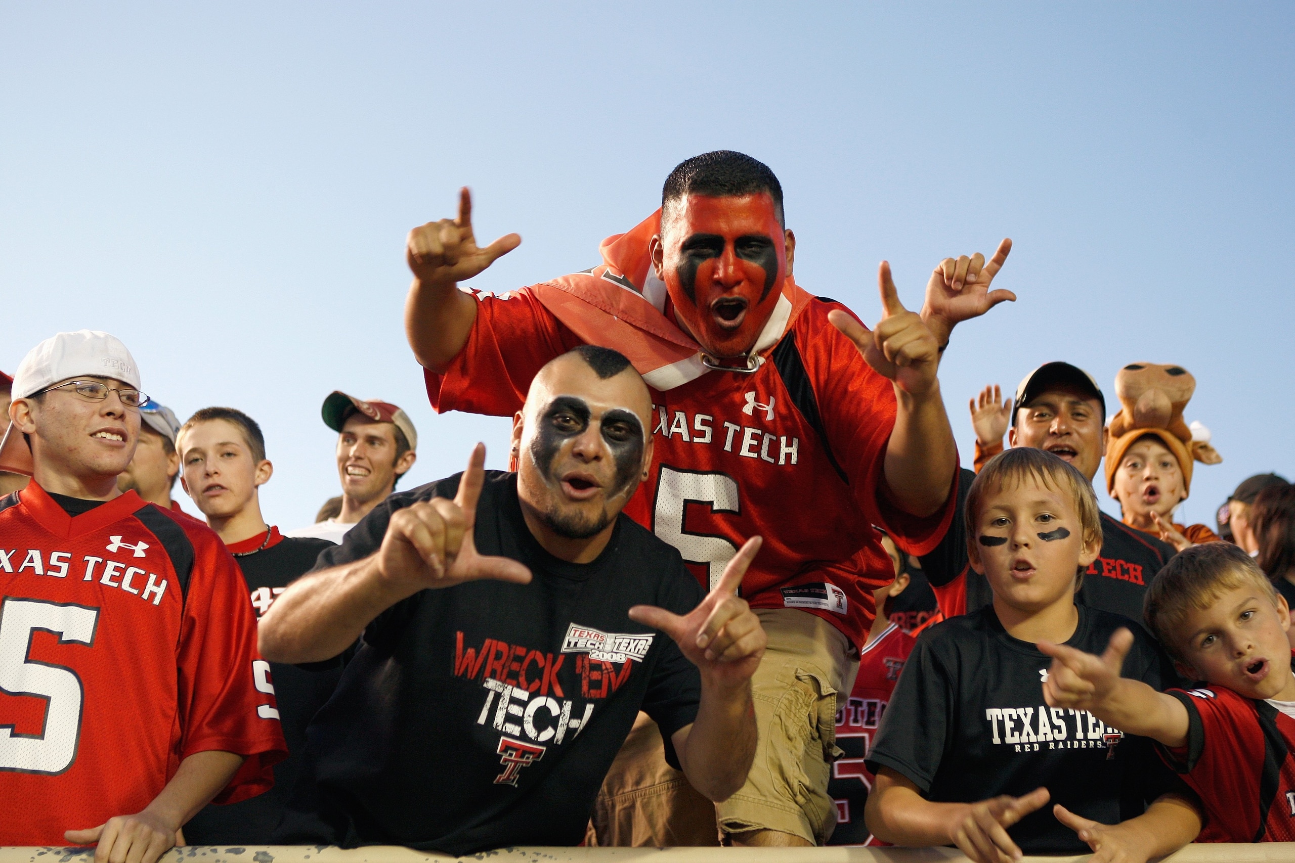 LUBBOCK, TEXAS - NOVEMBER 1:  Fans of the Texas Tech Red Raiders cheer in the stands before the game against the Texas Longhorns on November 1, 2008 at Jones Stadium in Lubbock, Texas. (Photo by: Jamie Squire/Getty Images)
