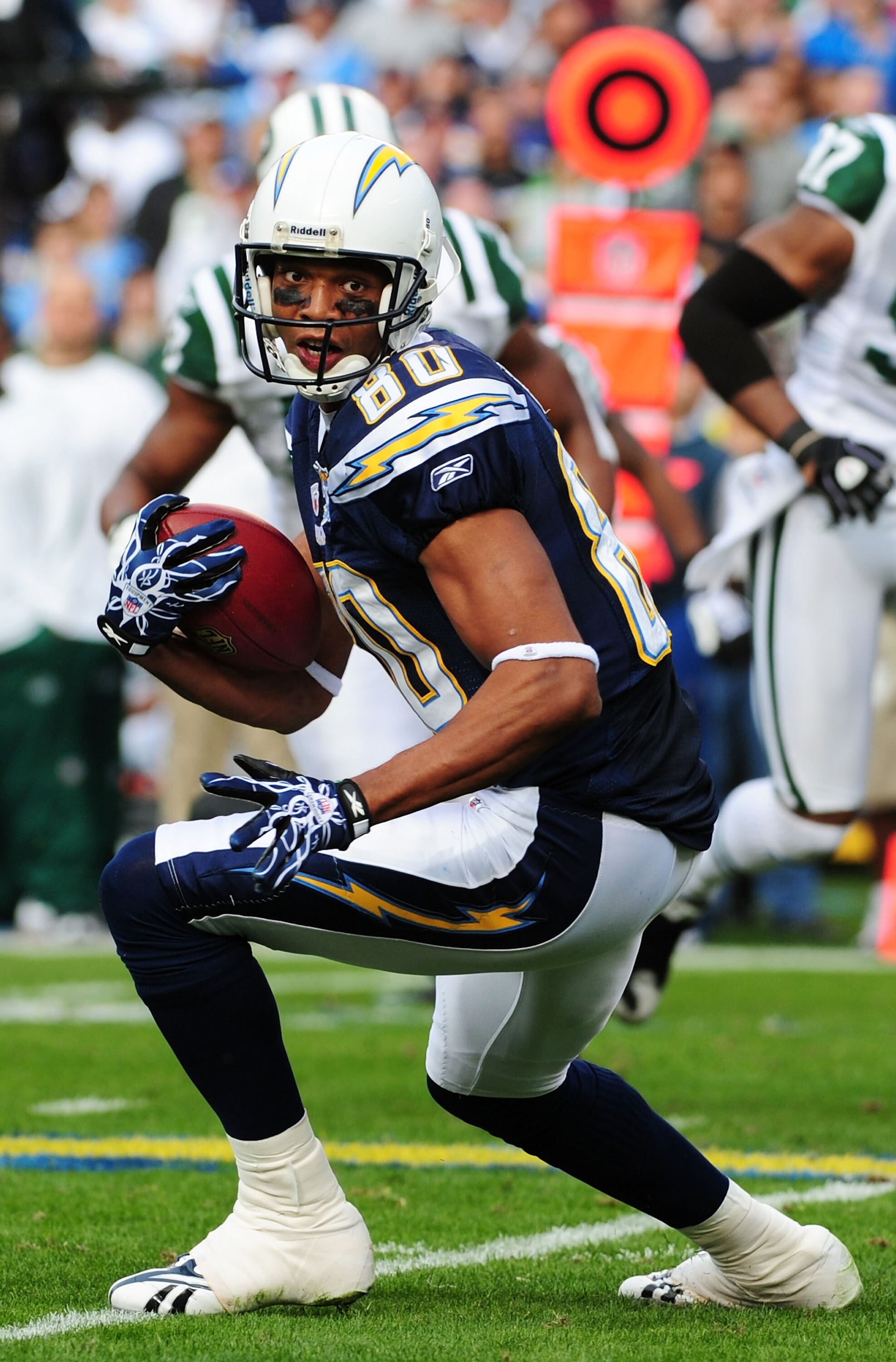 SAN DIEGO - JANUARY 17:  Wide receiver Malcom Floyd #80 of the San Diego Chargers looks to run with the ball after a catch against the New York Jets during  AFC Divisional Playoff Game at Qualcomm Stadium on January 17, 2010 in San Diego, California.  (Ph