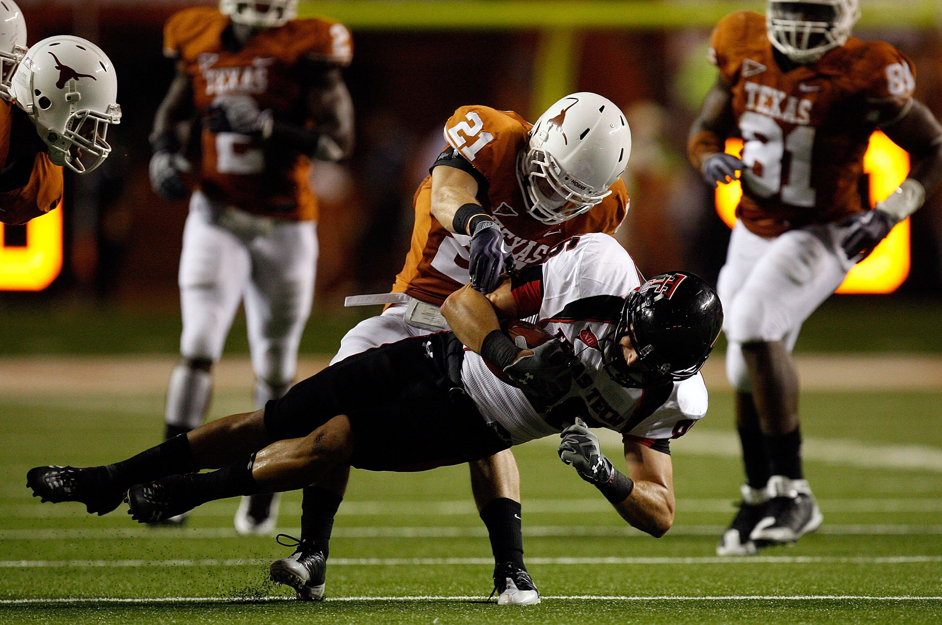 AUSTIN, TX - SEPTEMBER 19:  Wide receiver Alexander Torres #86 of the Texas Tech Red Raiders makes a pass reception against Blake Gideon #21 of the Texas Longhorns at Darrell K Royal-Texas Memorial Stadium on September 19, 2009 in Austin, Texas.  (Photo b