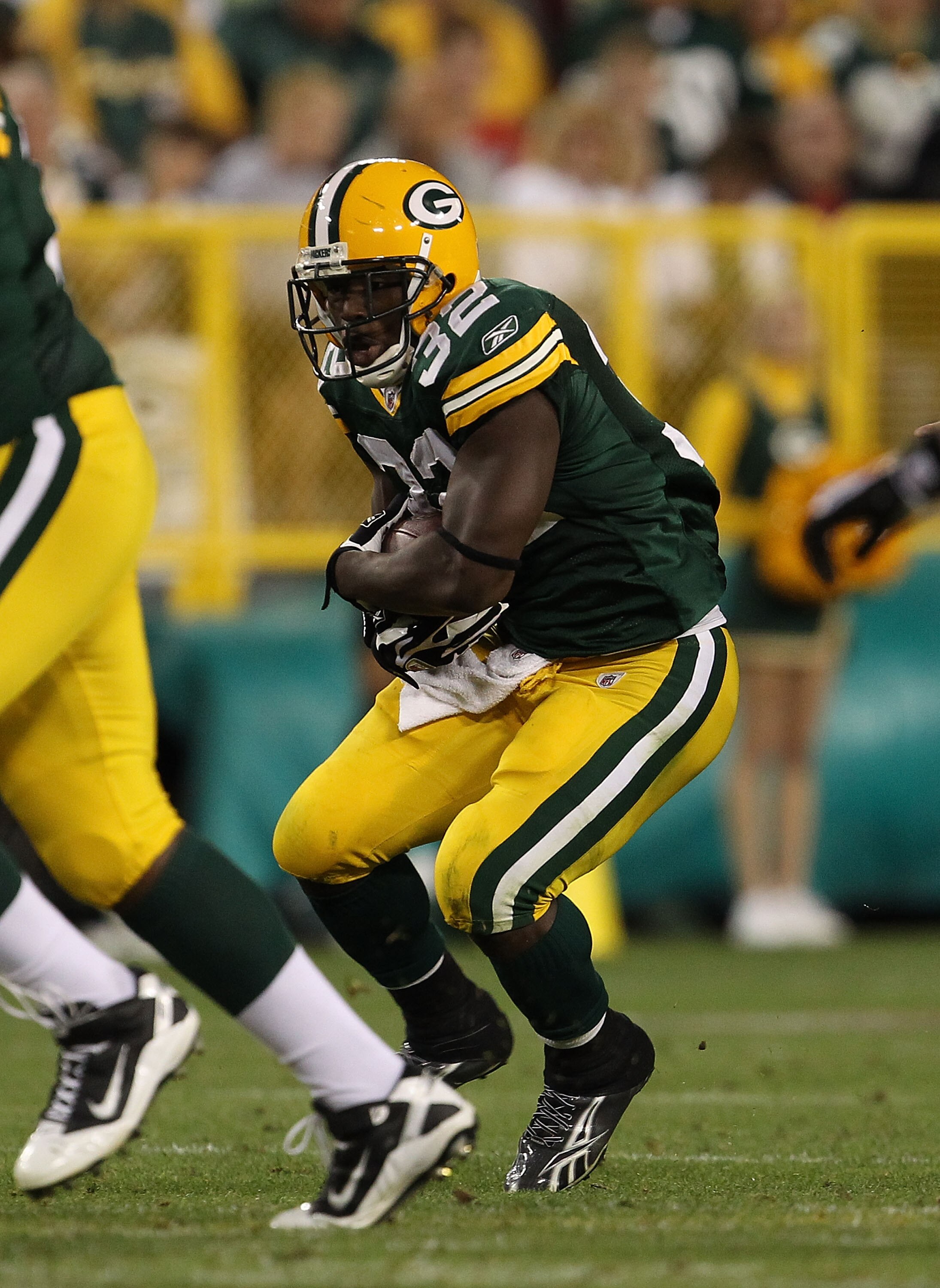 GREEN BAY, WI - AUGUST 26: Brandon Jackson #32 of the Green Bay Packers runs against the Indianapolis Colts during a preseason game at Lambeau Field on August 26, 2010 in Green Bay, Wisconsin. The Packers defeated the Colts 59-24. (Photo by Jonathan Danie