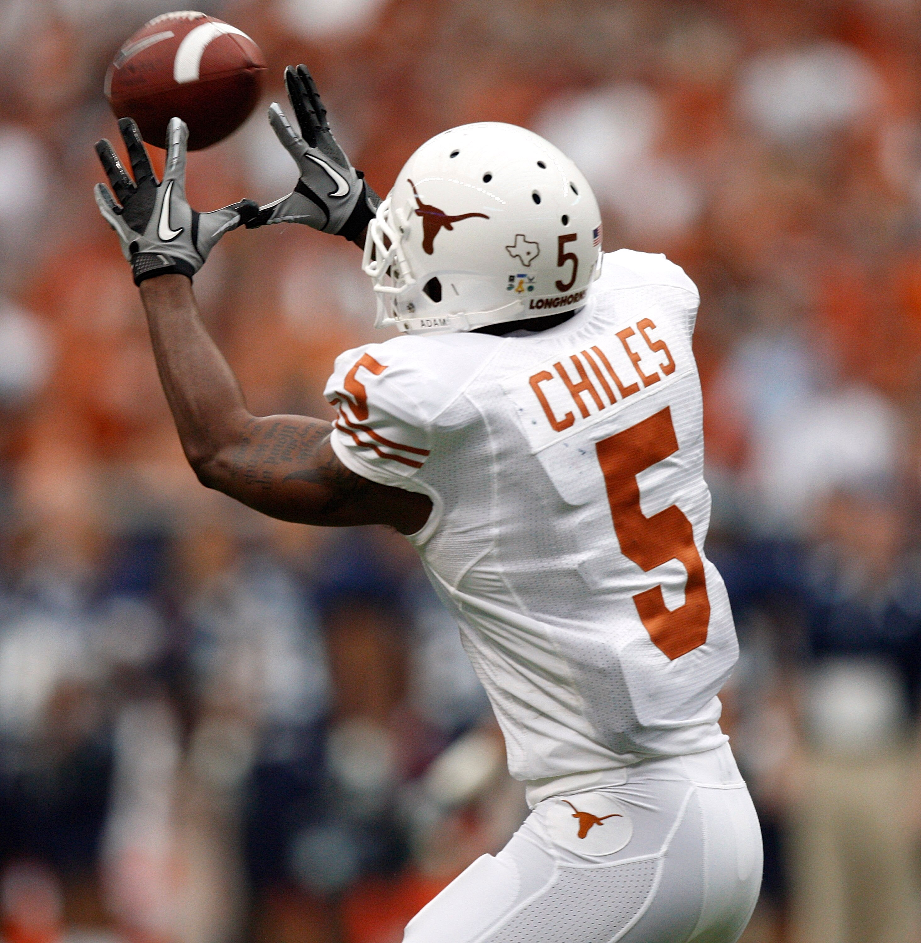 HOUSTON - SEPTEMBER 04:  Wide receiver John Chiles #5 of the Texas Longhorns completes a reception against the Rice Owls at Reliant Stadium on September 4, 2010 in Houston, Texas.  (Photo by Bob Levey/Getty Images)