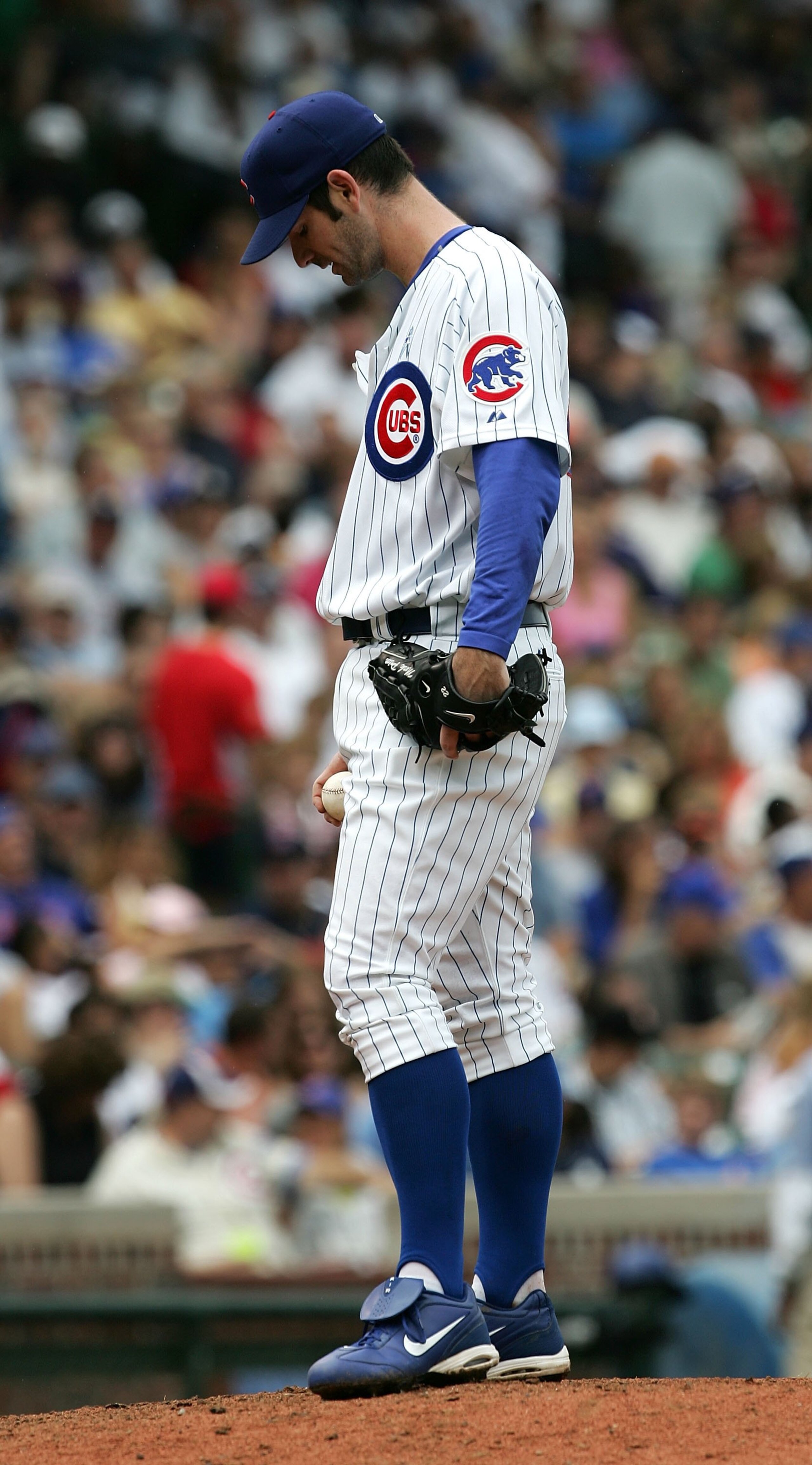 CHICAGO - JUNE 18:  Mark Prior #22 of the Chicago Cubs hangs his head after giving up a home run on the last pitch of his season debut against the Detroit Tigers on June 18, 2006 at Wrigley Field in Chicago, Illinois. The Tigers defeated the Cubs 12-3.  (