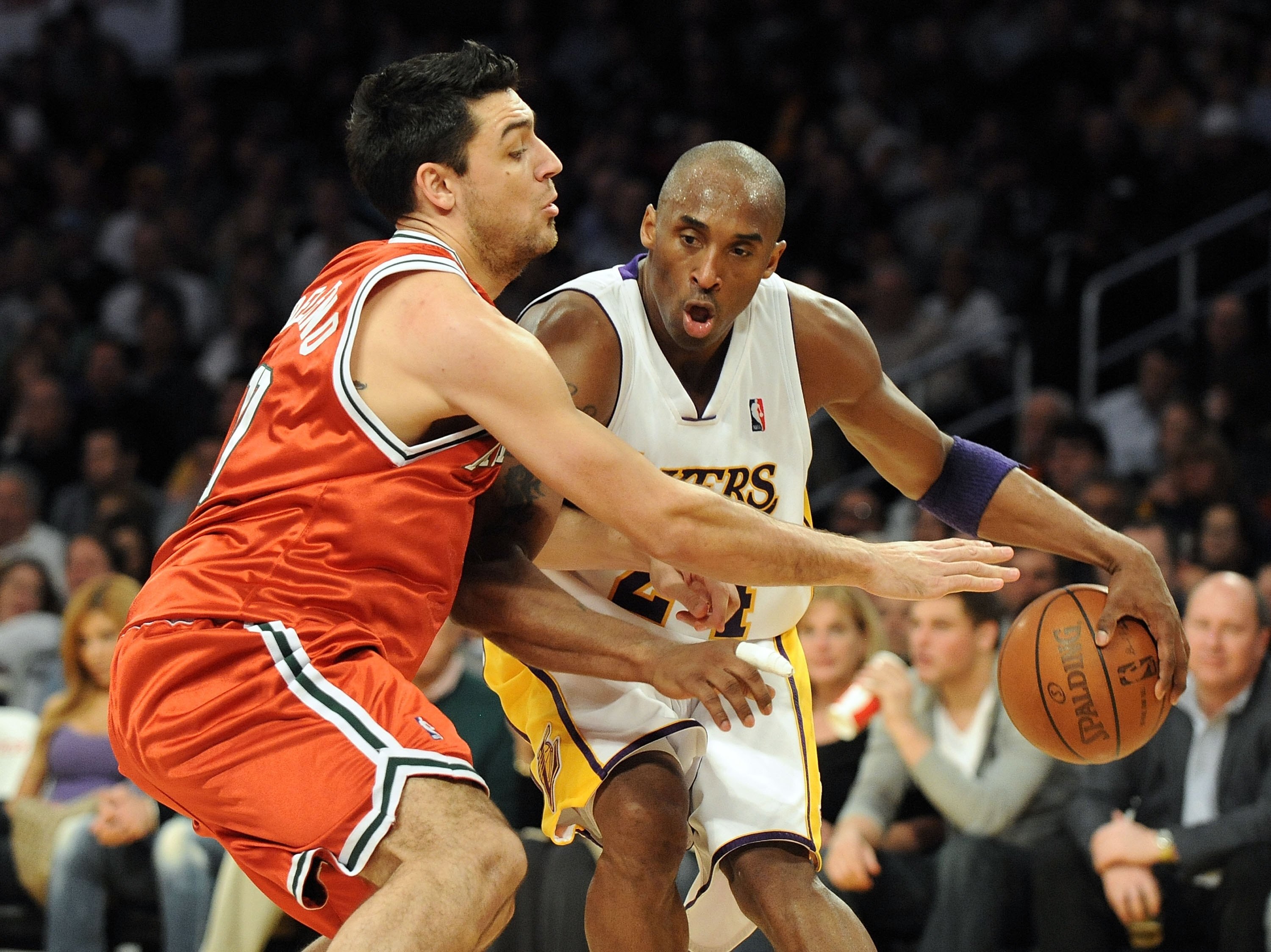 LOS ANGELES, CA - JANUARY 10:  Kobe Bryant #24 of the Los Angeles Lakers dribbles as he is guarded by Carlos Delfino #10 of the Milwaukee Bucks at Staples Center on January 10, 2010 in Los Angeles, California.  (Photo by Harry How/Getty Images)  NOTE TO U